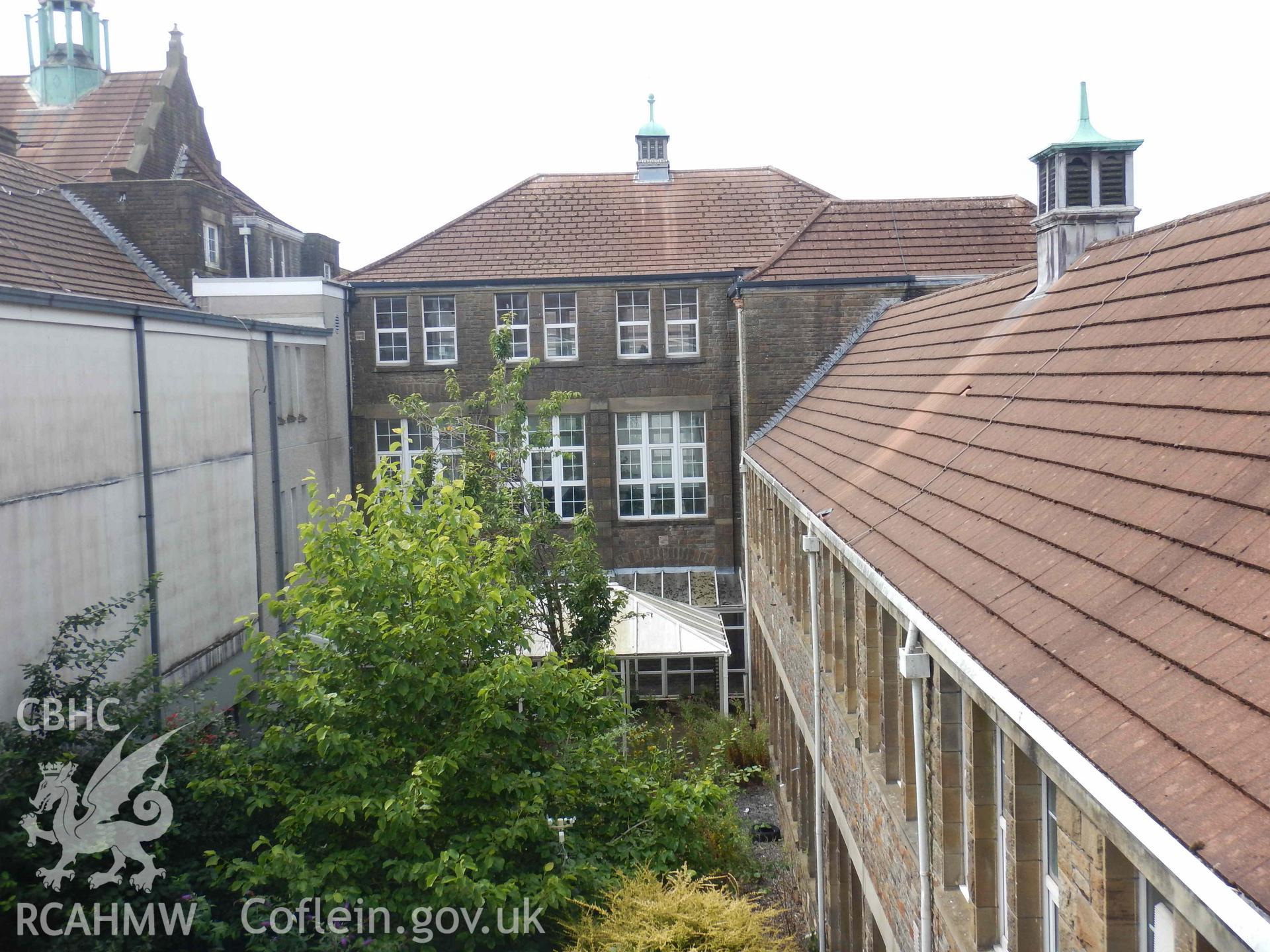 Exterior Looking west across the eastern courtyard to the central block. Photograph from an Archaeological Level 3 Building Recording for The Former Women’s Training College, UWSTD Townhill Campus, Townhill Road, Swansea. Dated 2021. Project: AW2915.