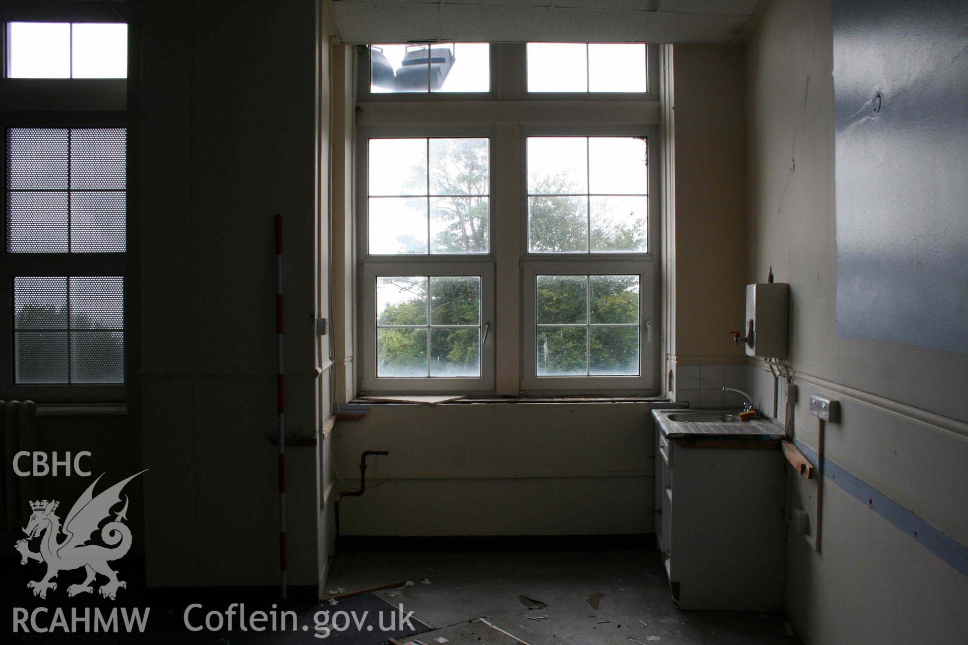 Sink area in the south-west corner of Room 7, looking south. Photograph from an Archaeological Level 3 Building Recording for The Former Women’s Training College, UWSTD Townhill Campus, Townhill Road, Swansea. Dated 2021. Project: AW2915.