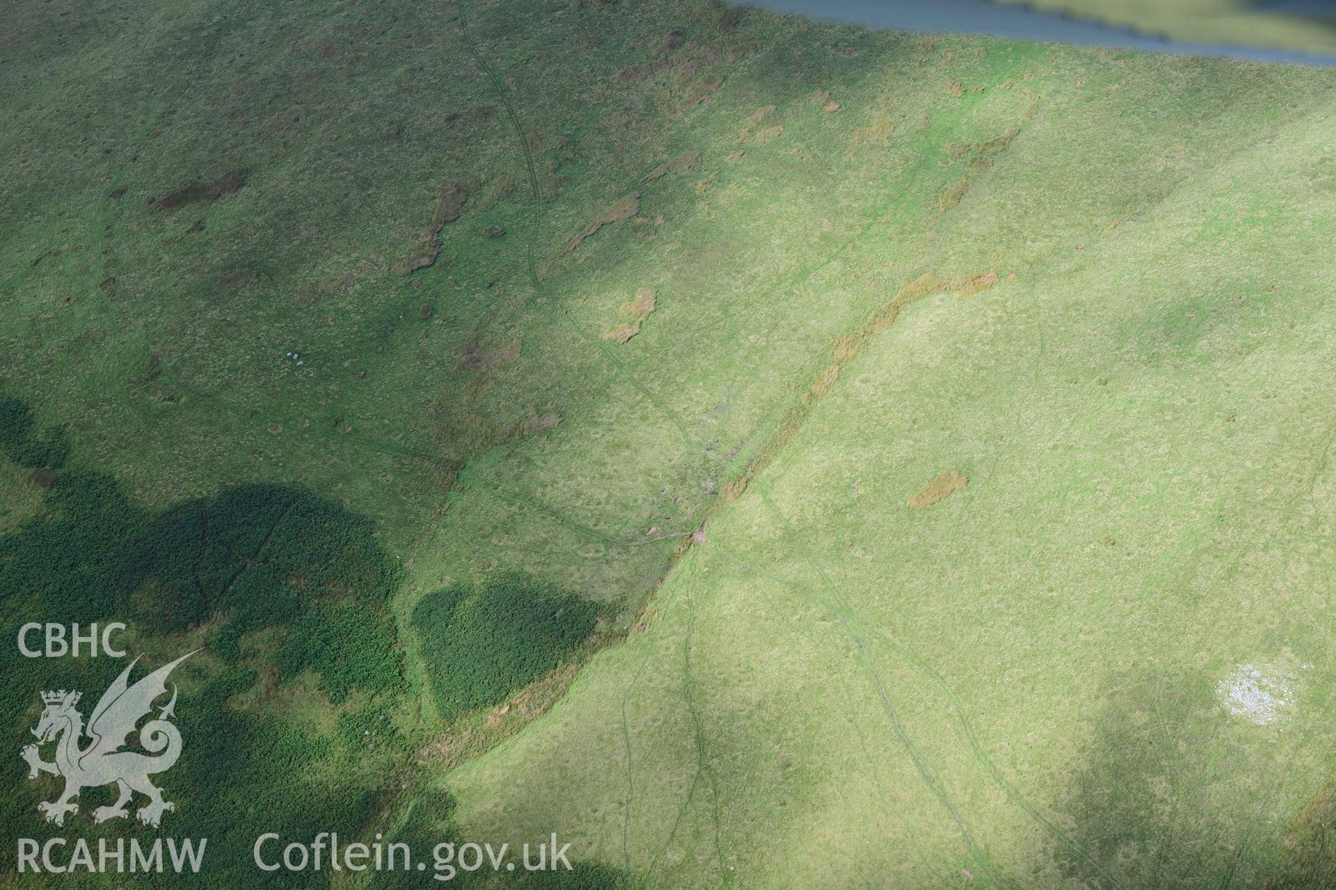 Garn Wen prehistoric cairn, wide view showing group of three boulders 250 NW of cairn at SN 9321 4094
