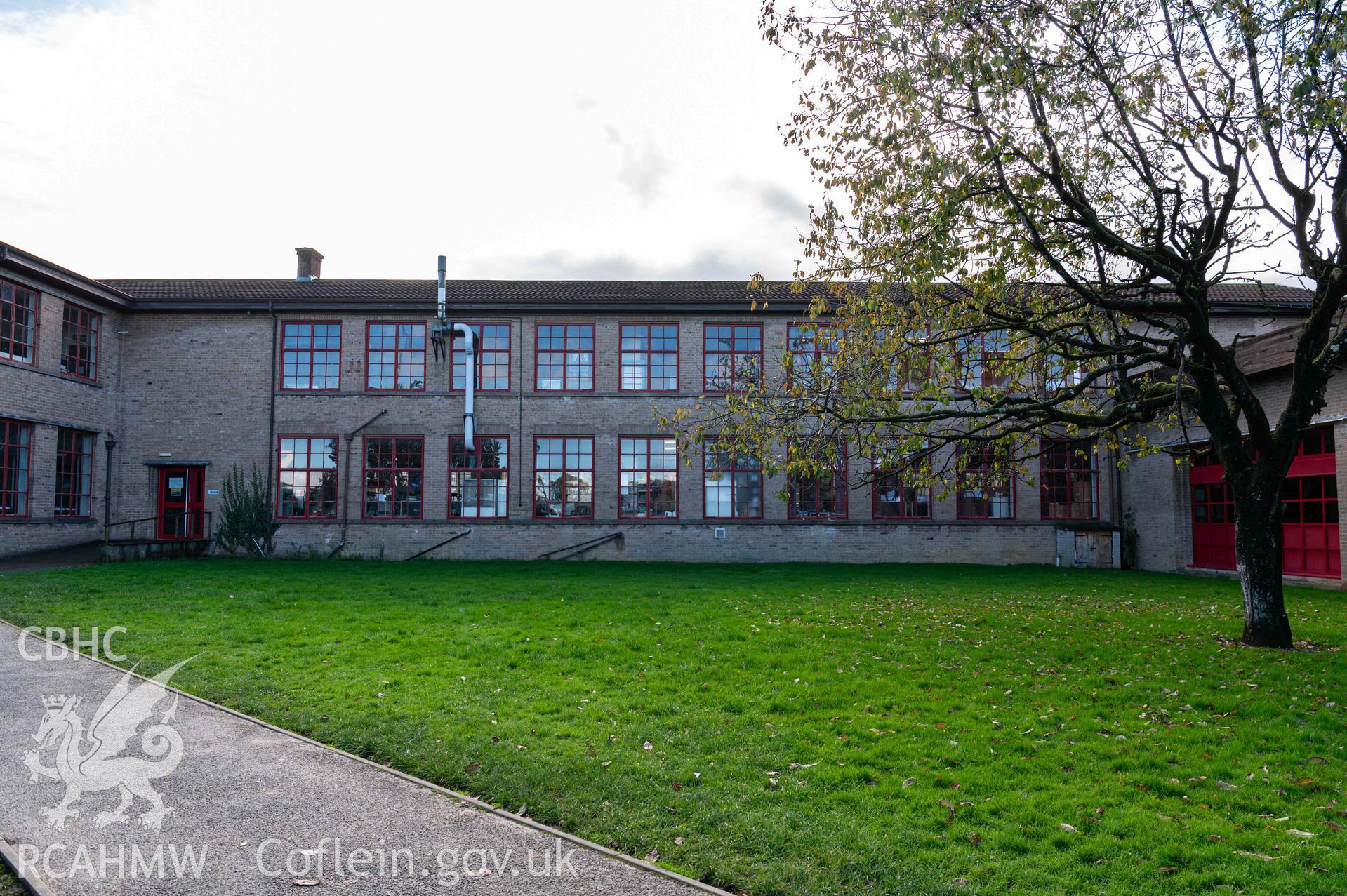 North elevation of central square. Two storeys, large paned windows