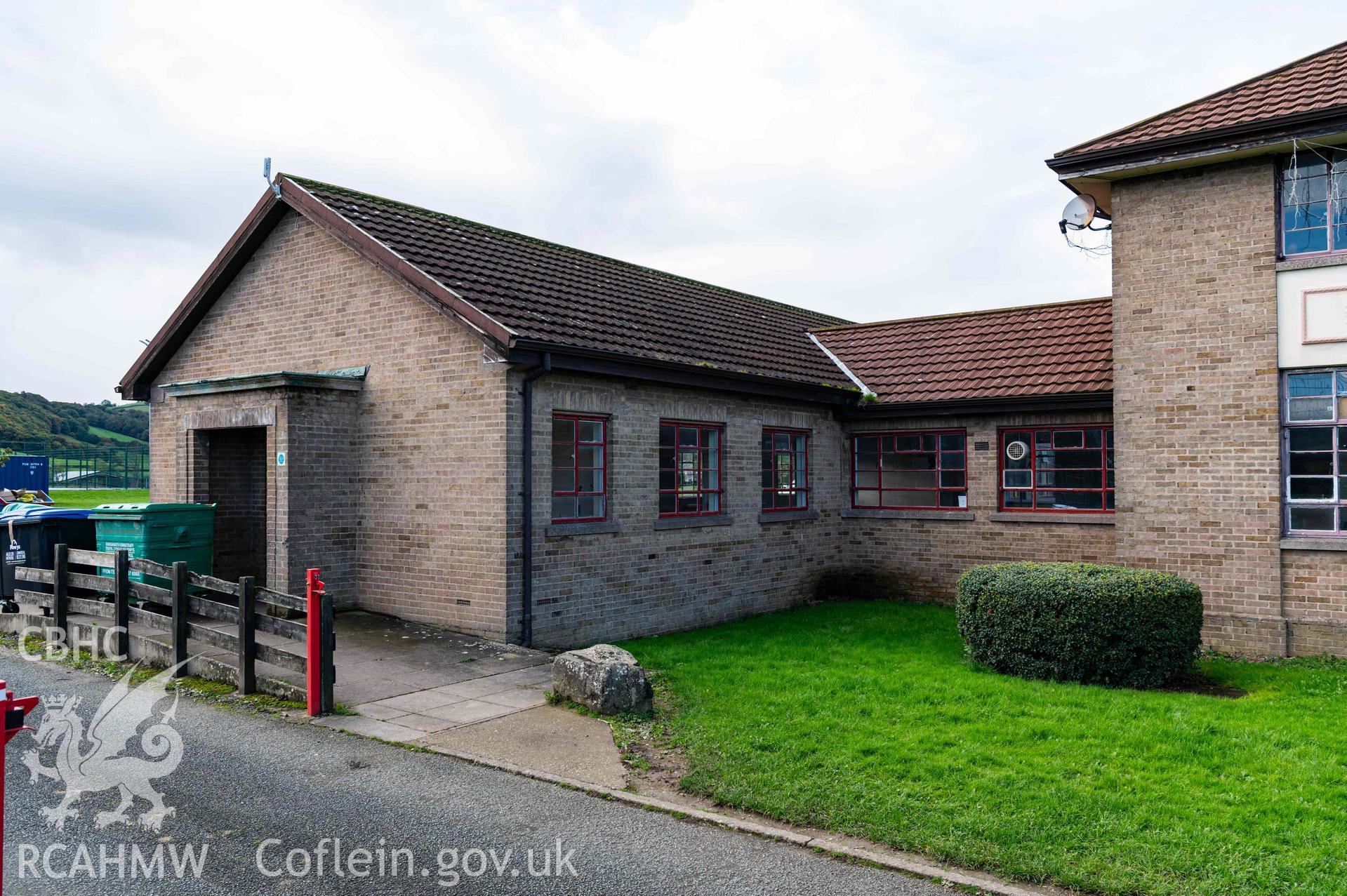 Porched entrance to gable end, south wing of east elevation of outbuilding at sports pitch