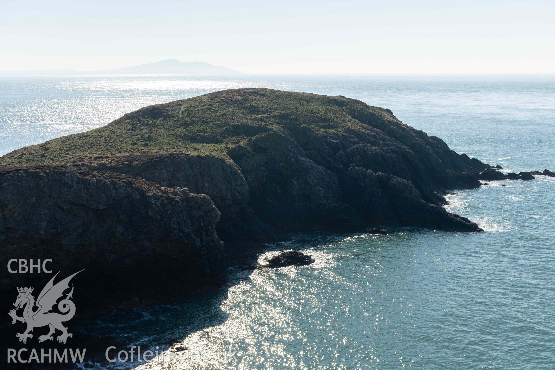 Ynys y Fydlyn. Rock cut platforms and banks on the northern side of the western islet. View from the mainland to the northeast.