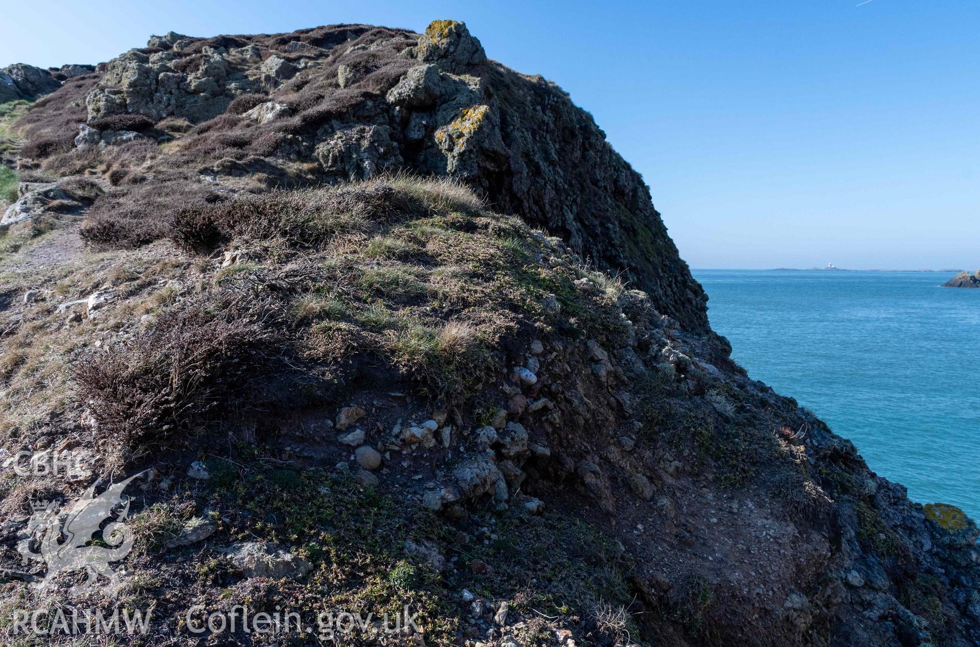 Ynys y Fydlyn. Eroding wall core at the eastern end of the rampart on the eastern islet.