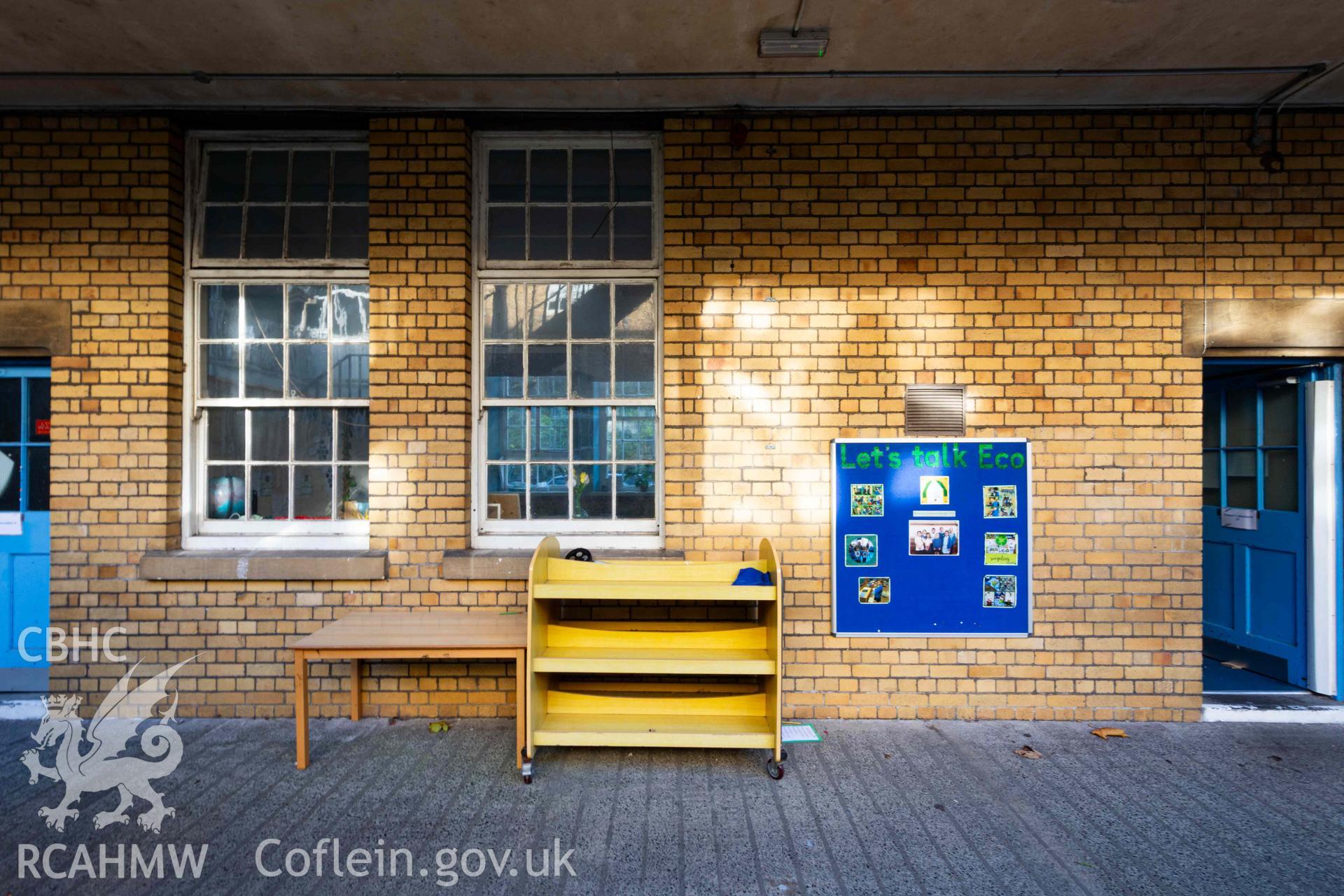 South wing classrooms elevation from courtyard. Brick detail, tall sash windows and doors