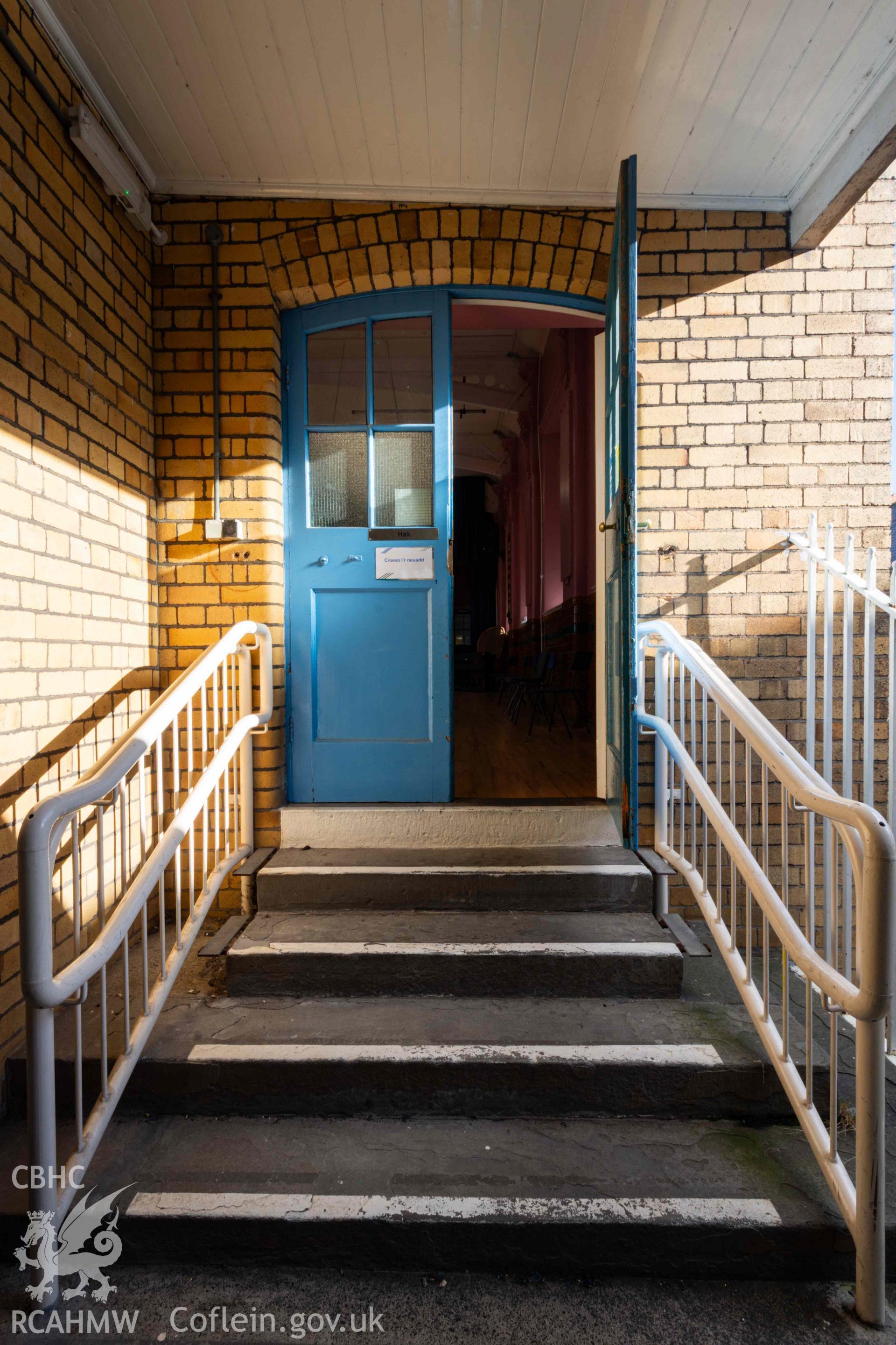 Steps and doors into assembly hall. First floor, north west corner
