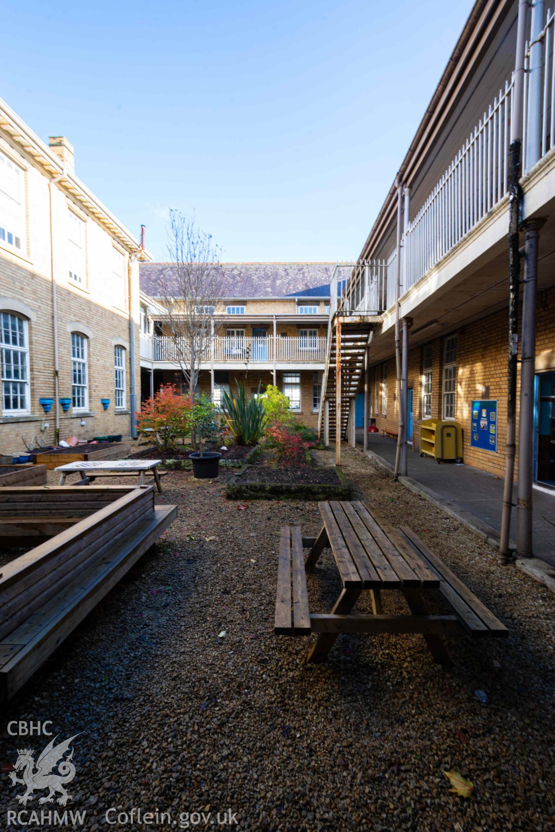View of courtyard, looking east. Portrait orientation