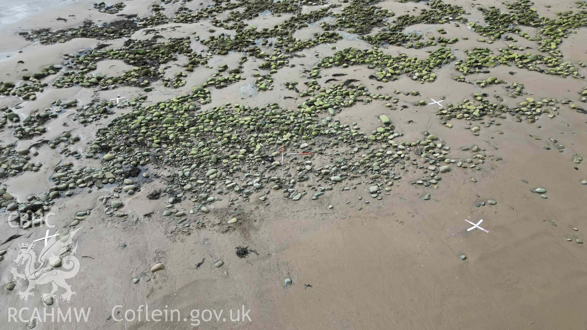 Oblique view of the shipwreck on Llandanwg Beach, looking west on 28/03/2025, scales are 1m.