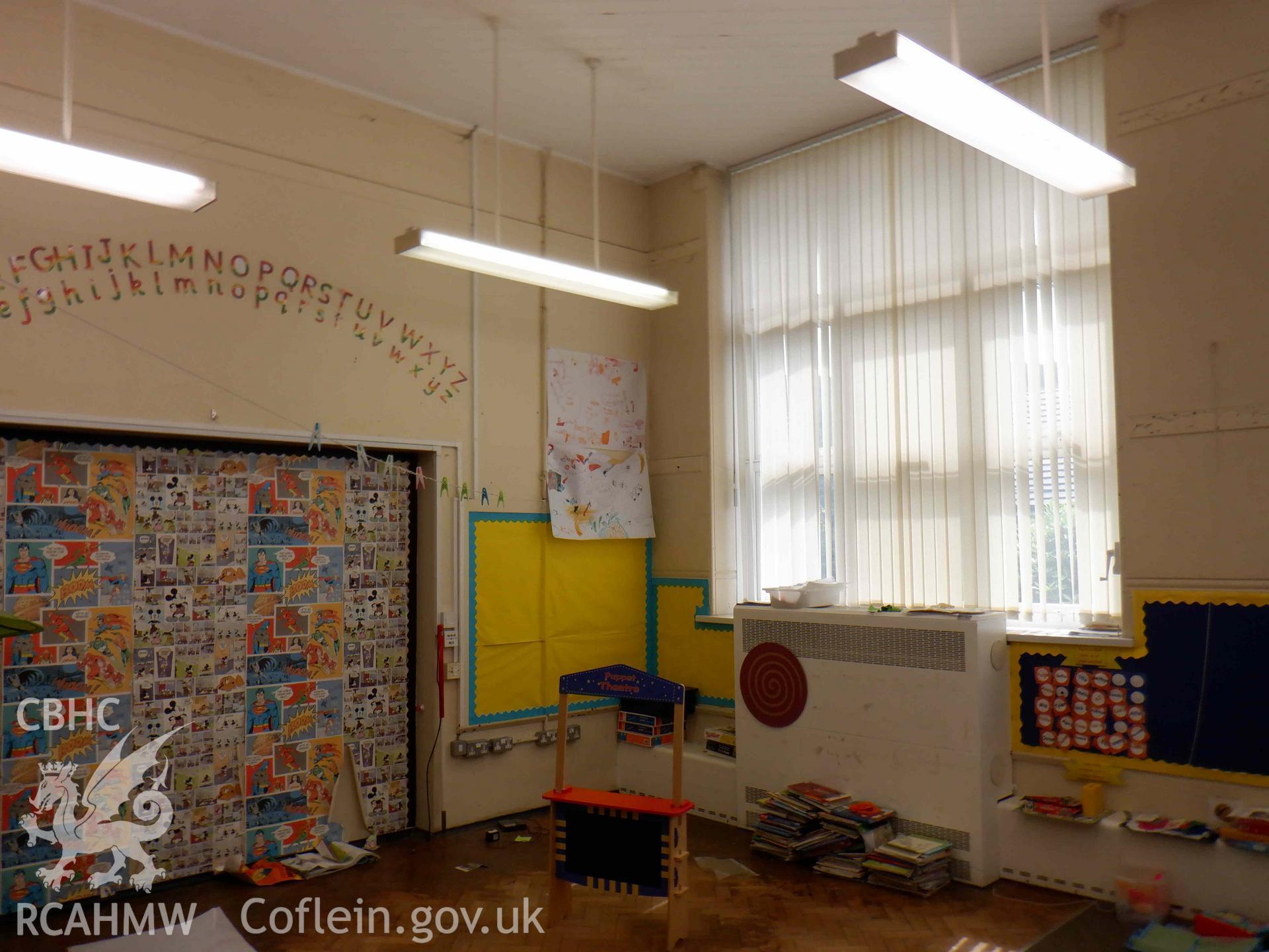 Photograph showing Infants block, Unit 2, Room 03, ground floor. Shot of east corner of classroom.  from a Level 2 Building Recording for Godre’rgraig Primary School, Godre’rgraig, Swansea. Dated 2023. Project: AW3096.