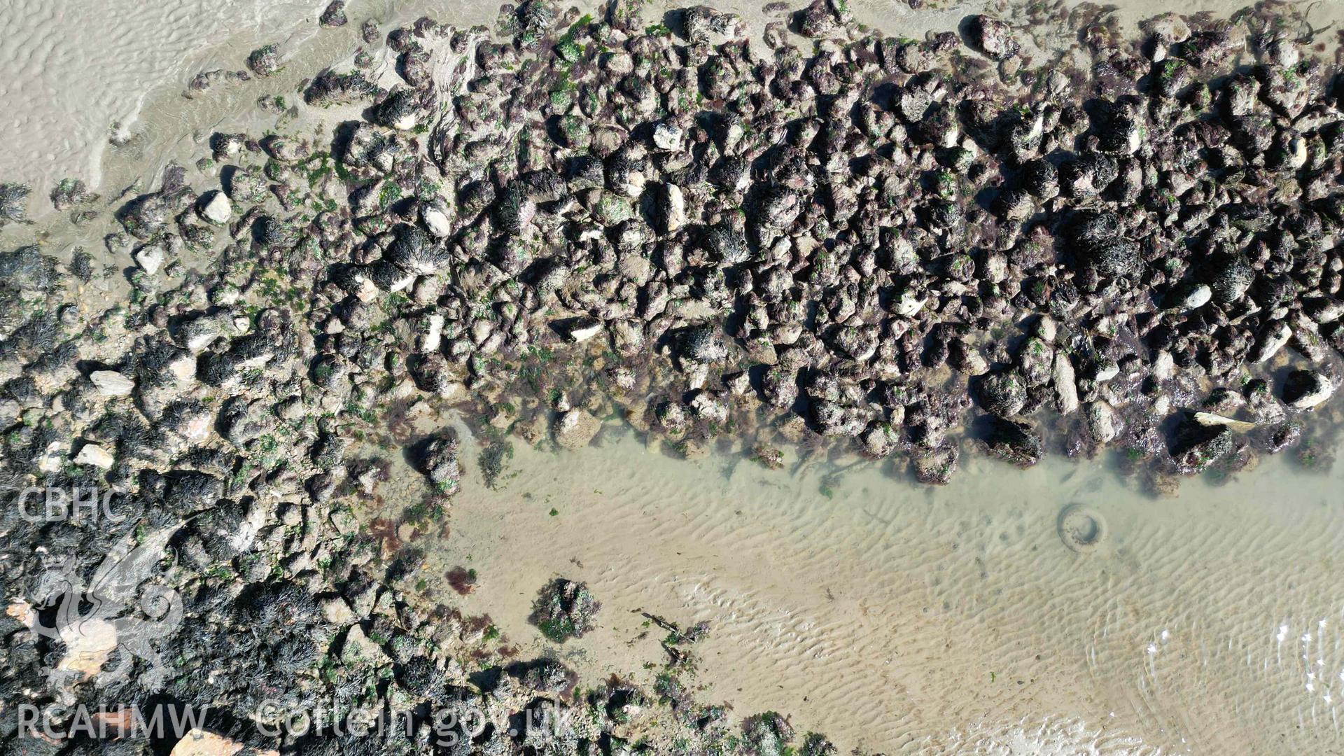 Goodwick Fish Trap 1 at low water on 30/03/2025. Overhead view of the junction between the fish trap and the modern rock armour sea defence (lower left).