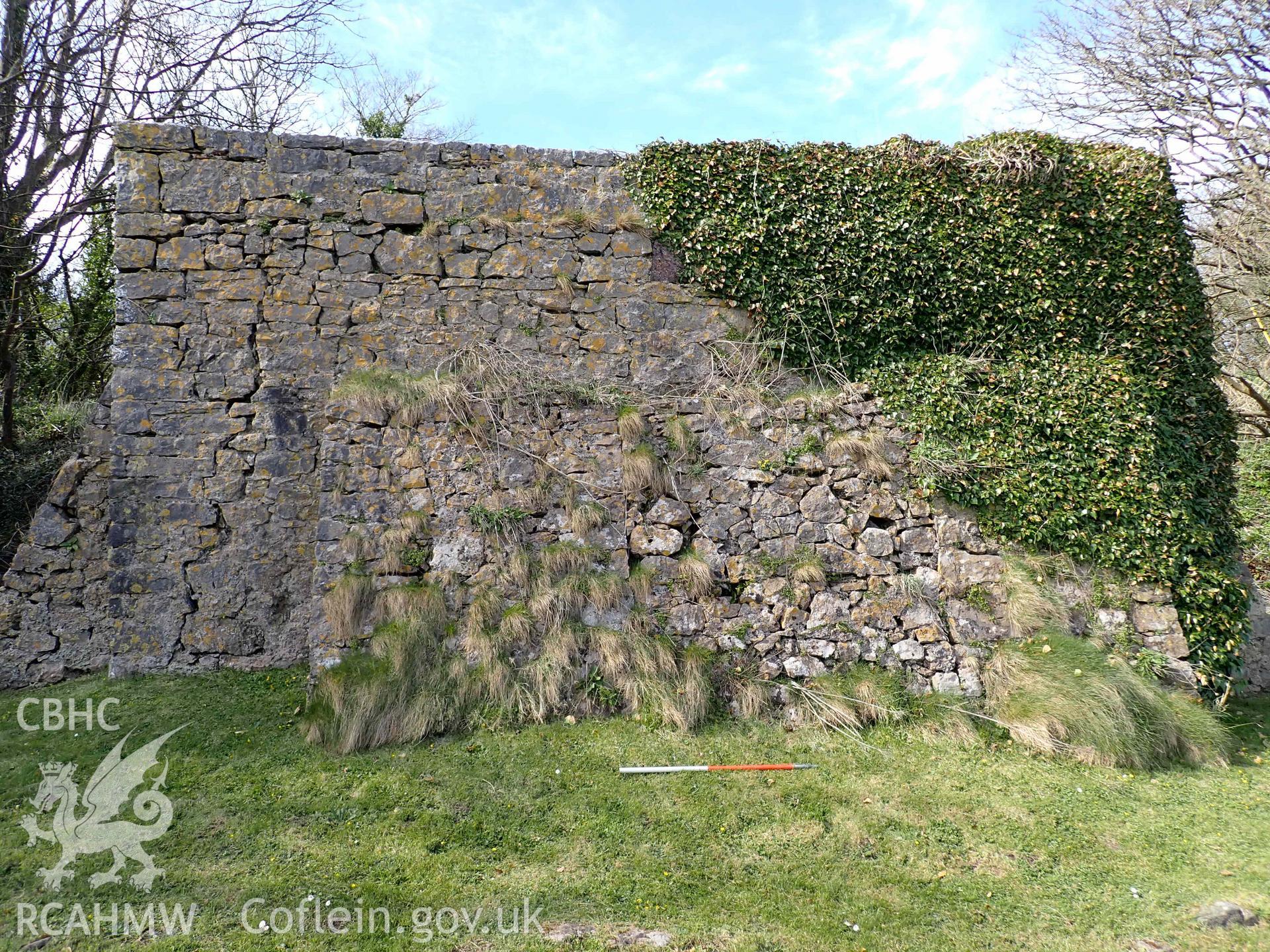 Main wall on the eastern side of the lime kiln at Stackpole Quay, on 31/03/2025. Scale is 1m.