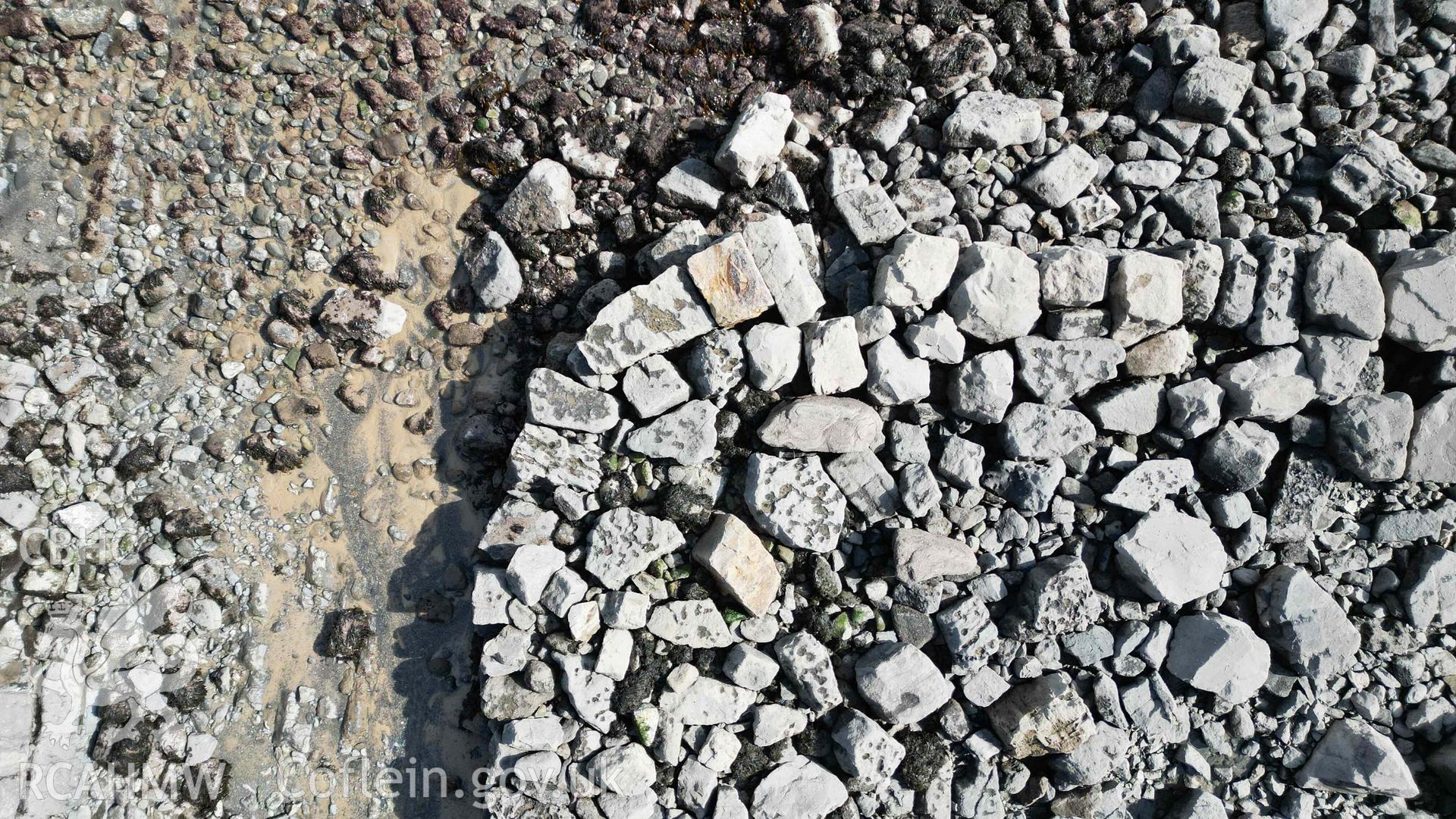 Overhead view of the northeast corner of the outer area of the breakwater at Stackpole Quay, on 31/03/2025, north is to the left.