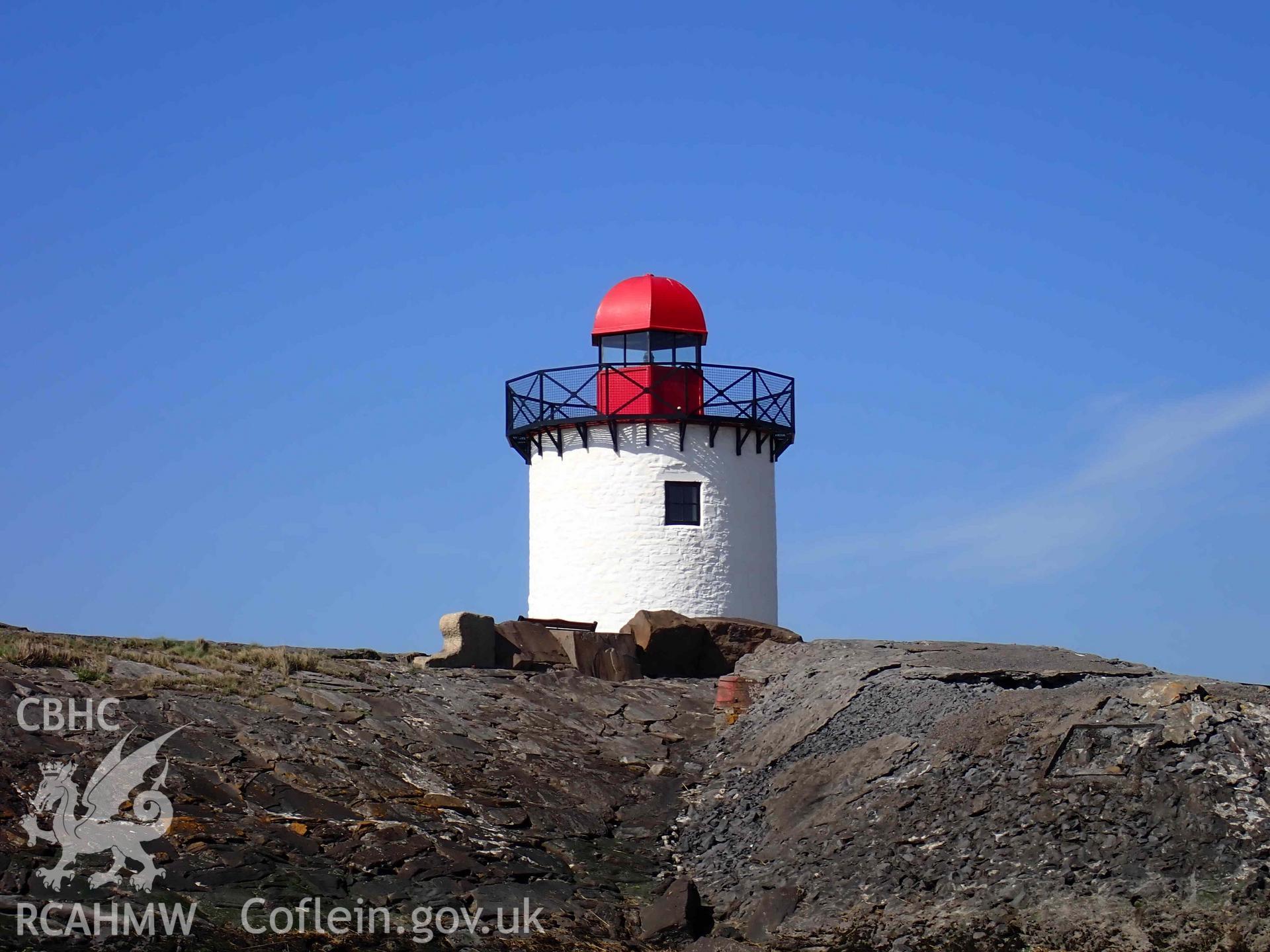 Burry Port Lighthouse, viewed from the beach on the eastern side of the breakwater, on 01/04/2025.
