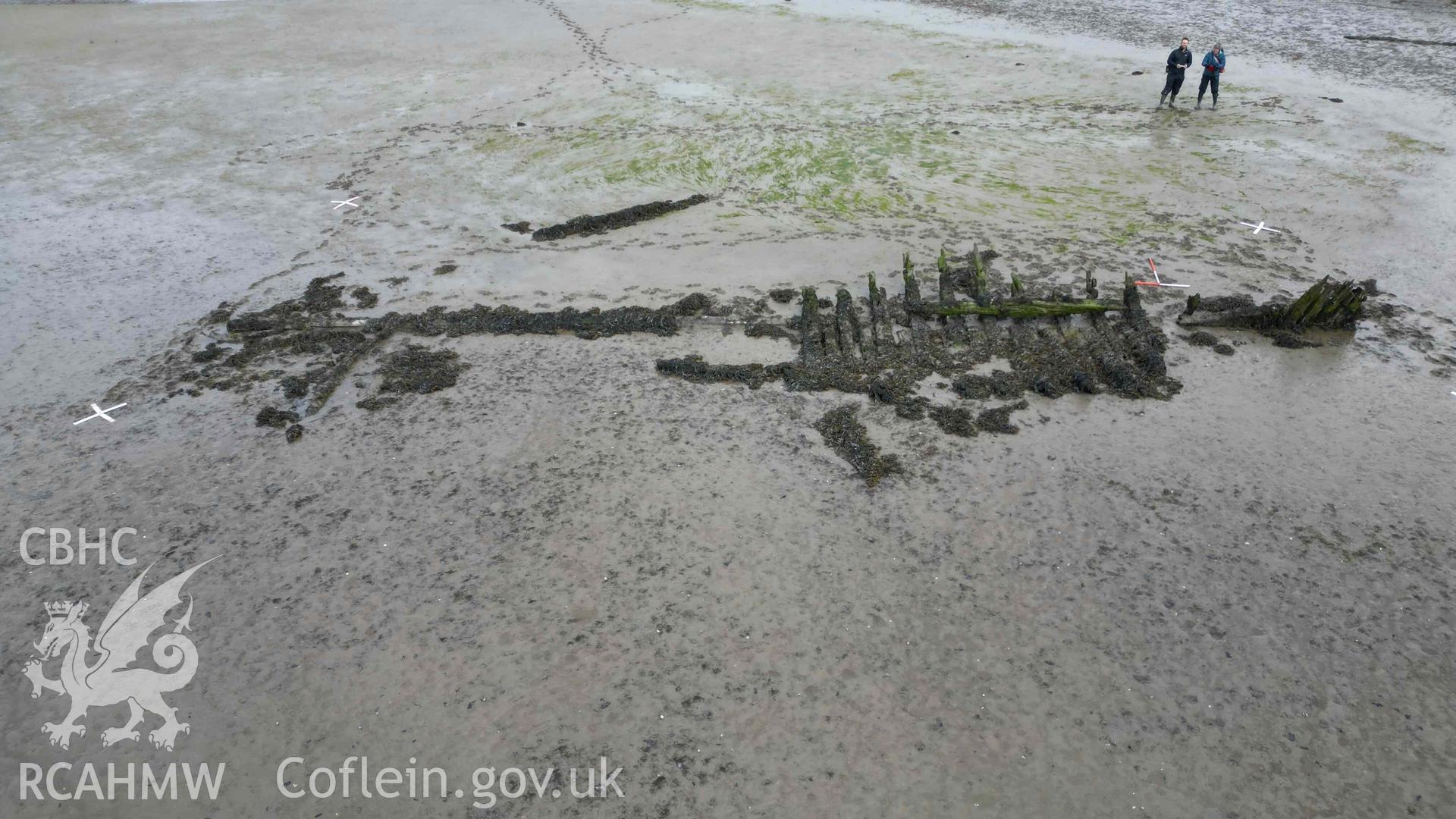 Oblique view of the wreck in the estuary at Pensarn, looking north on on 28/03/2025. Scales are 1m.