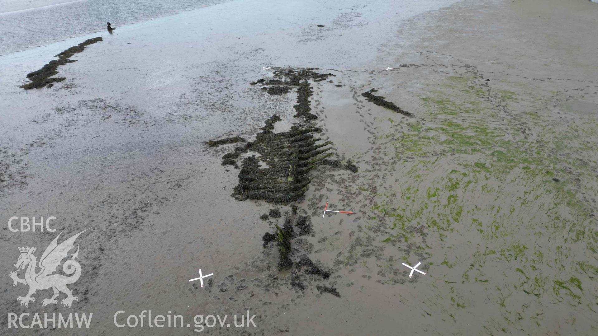Oblique view of the wreck in the estuary at Pensarn, looking west on on 28/03/2025. Scales are 1m.