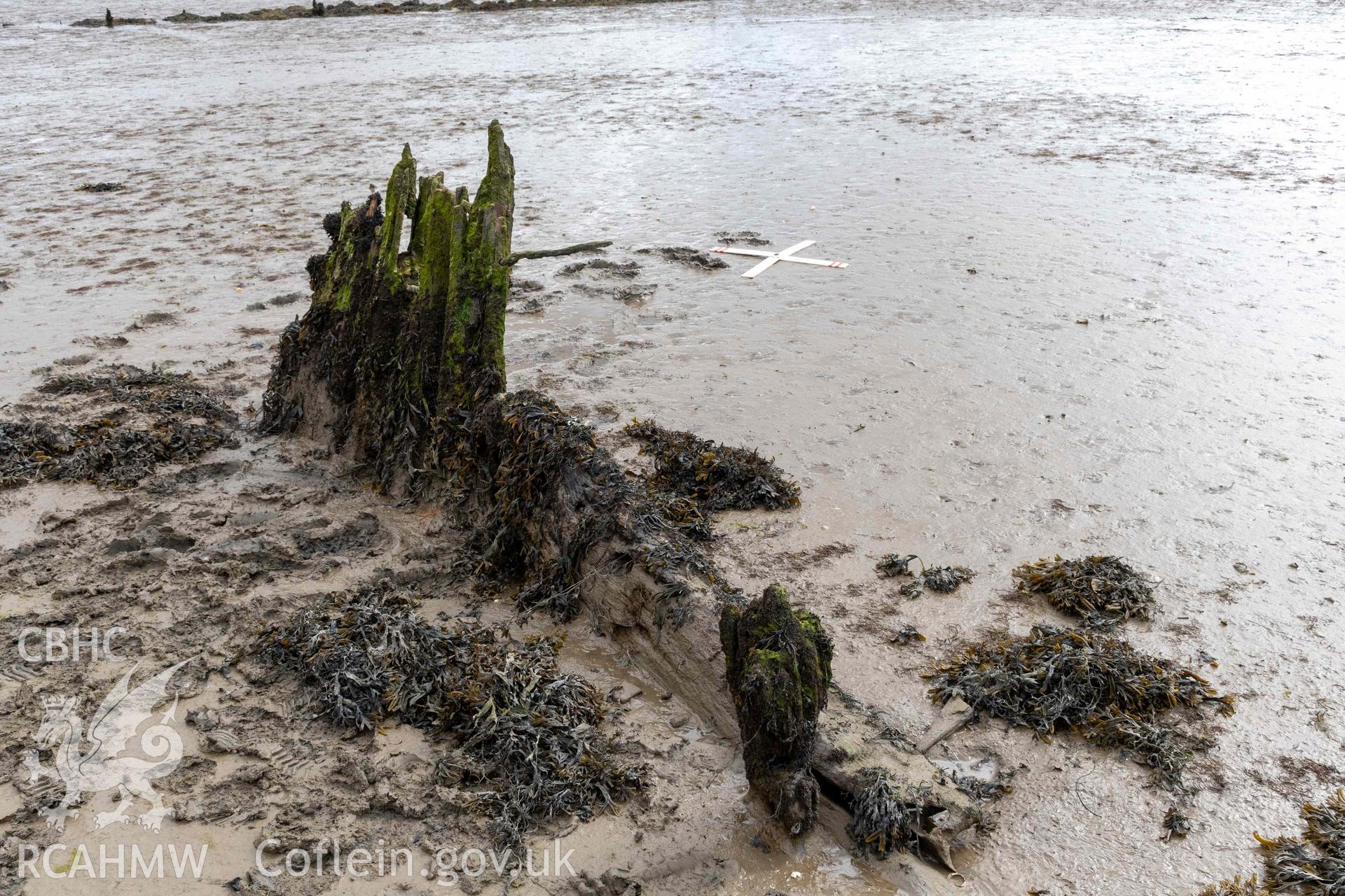 Rudder (left), stern-post and stern-knee, of the wreck in the estuary at Pensarn on 28/03/2025.