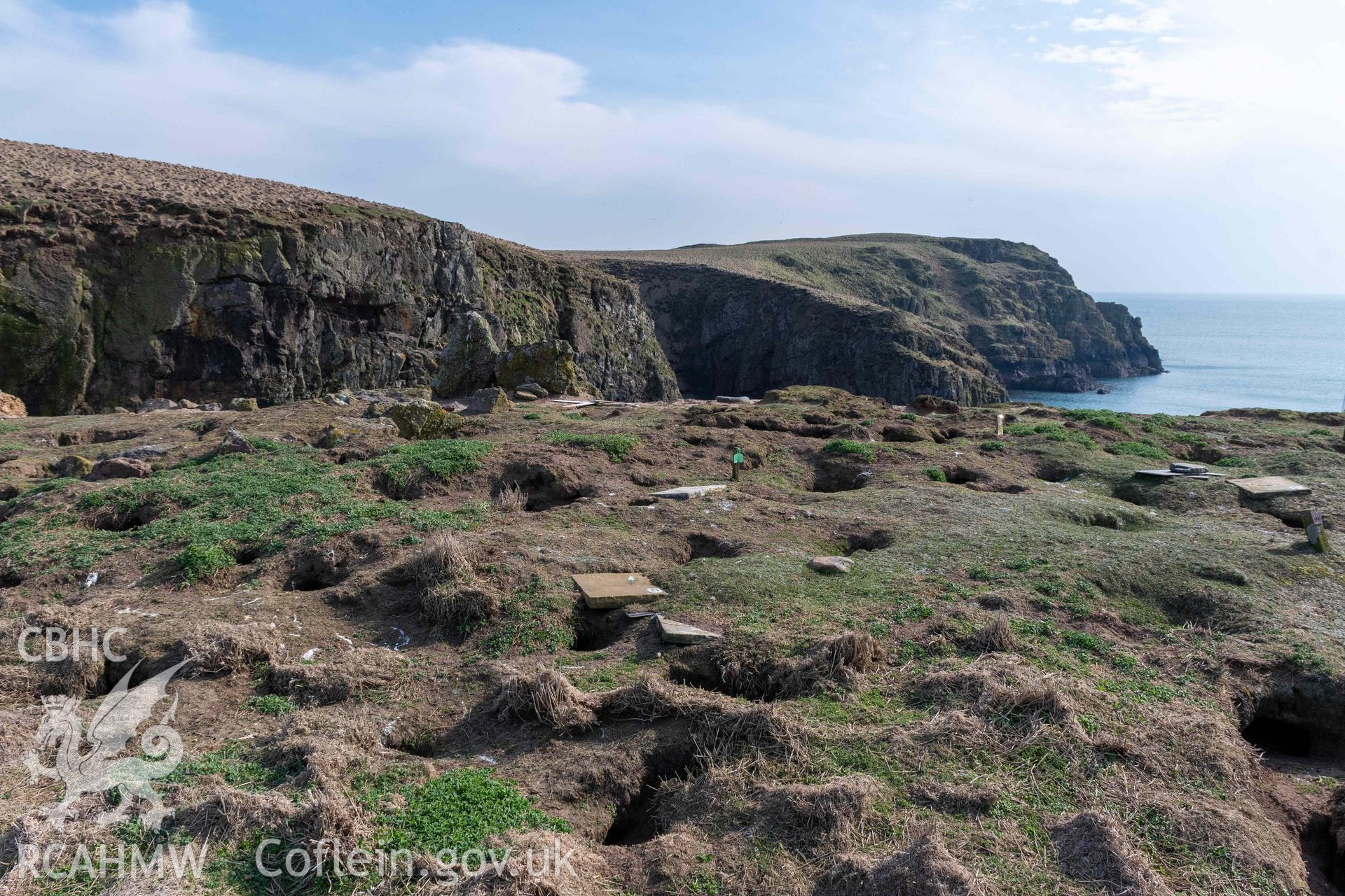 View from the northwest looking across to the stone remains of the southwest corner of the rectangular building.