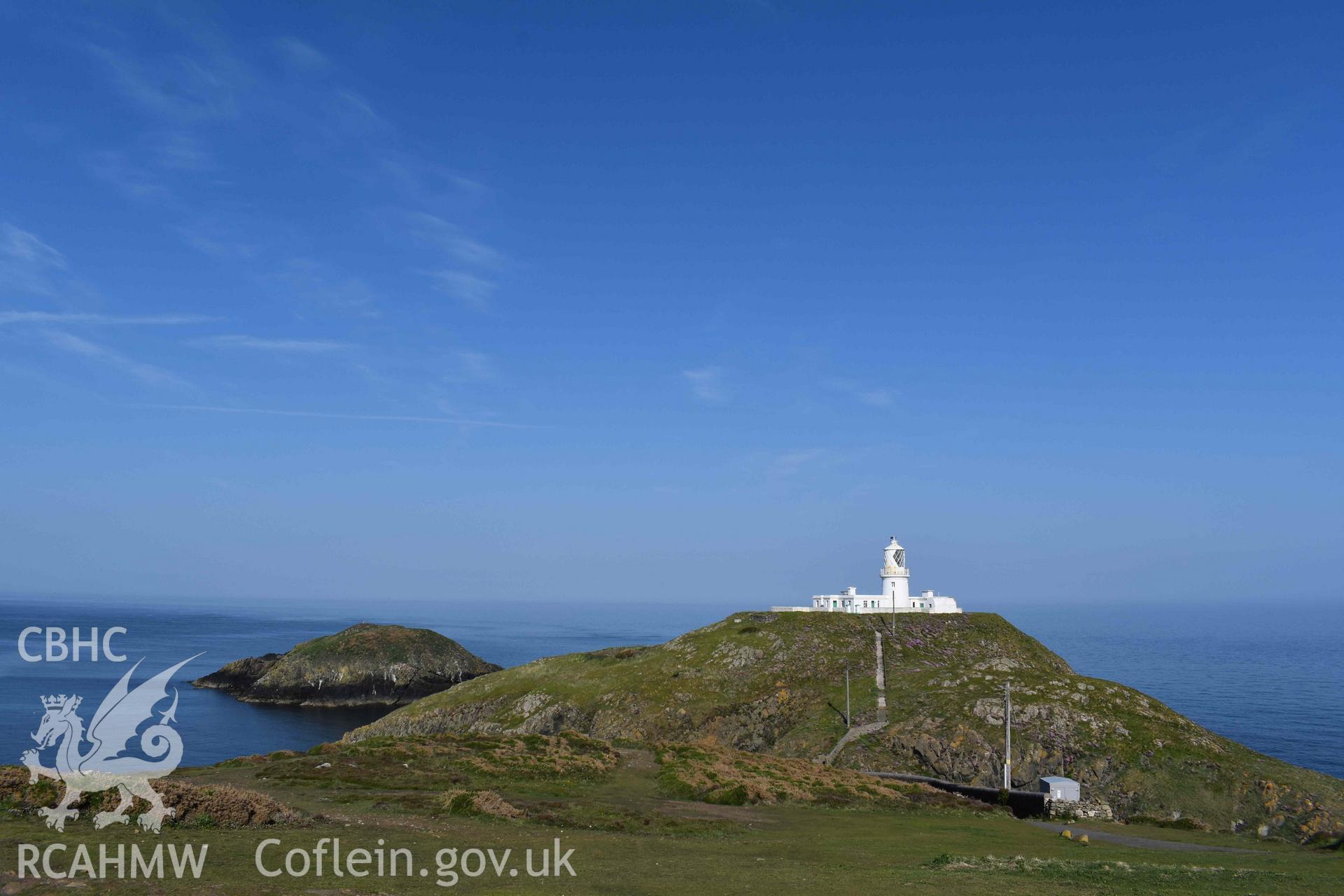General view of Ynys Meicel and Strumble Head Lighthouse viewed from the east-southeast on 20/05/2025. Ynys Onnen can be seen in the background.