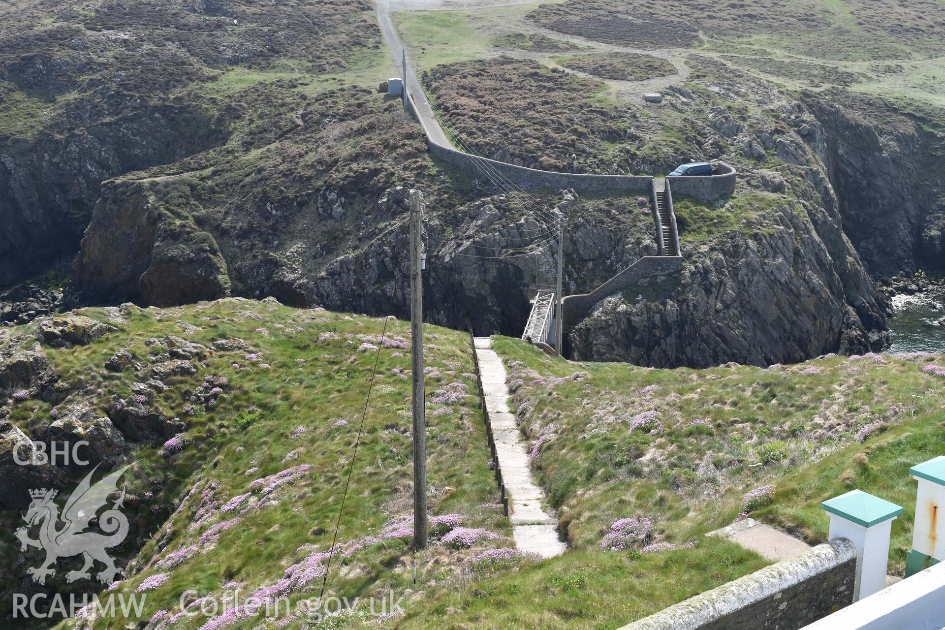 Strumble Head Lighthouse, access route and bridge between Ynys Meicel and the mainland, viewed from the lighthouse tower, on 20/05/2025.
