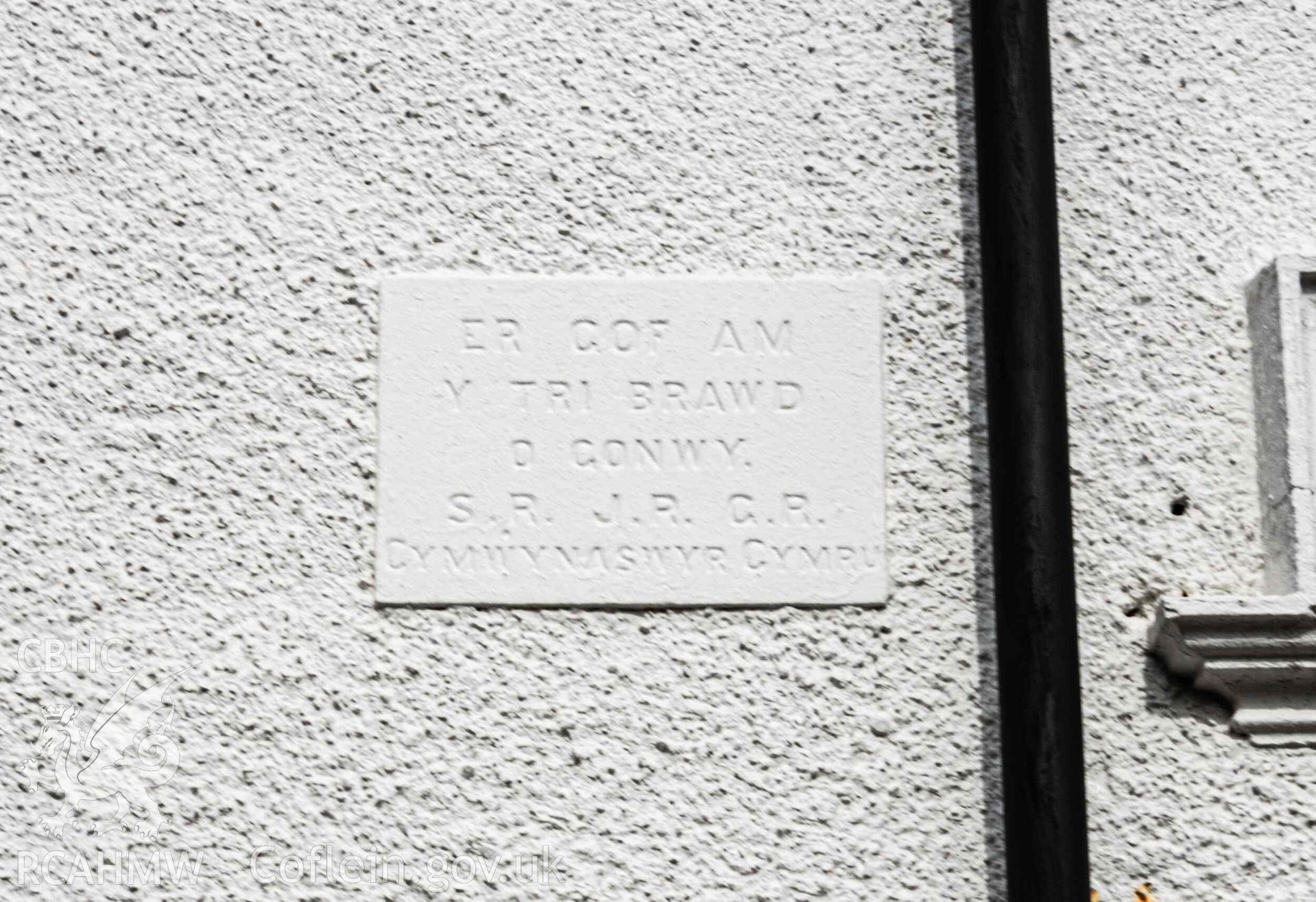 Inscribed stone on south east elevation of vestry. 'Er cof am y tri brawd o Gonwy. S.R.  J.R. G.R. Cymwynaswyr Cymru'