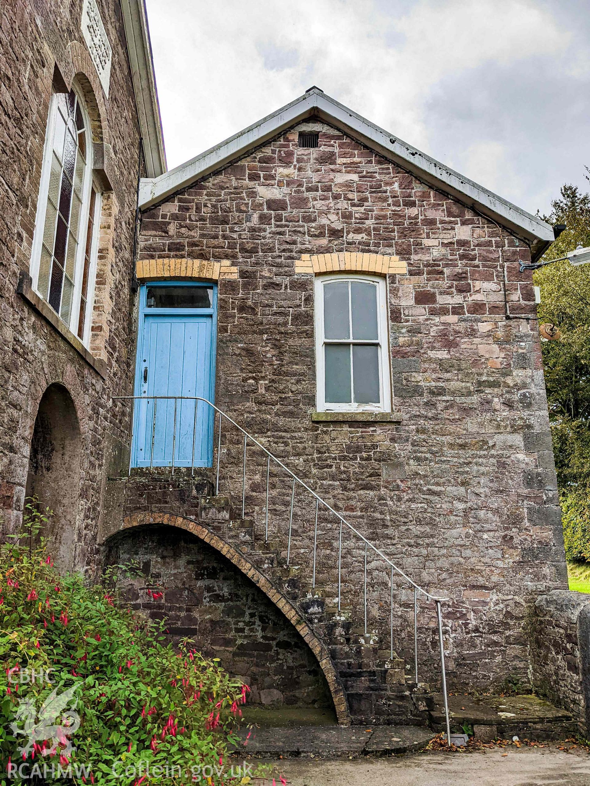 Stairs and door to upper level