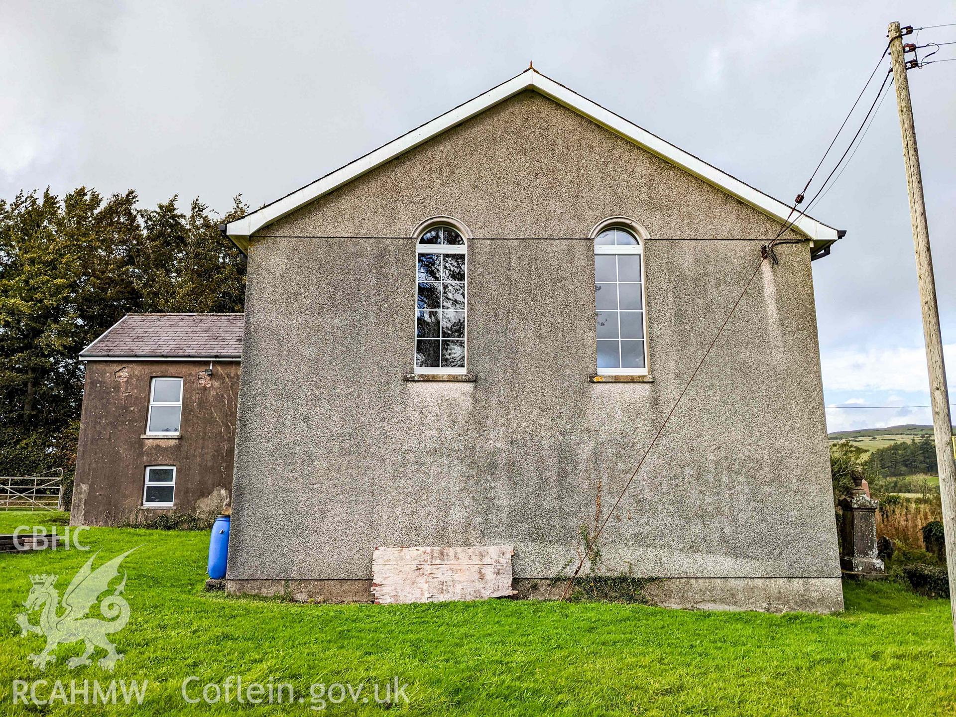 Rear (south) elevation. Two round-headed windows