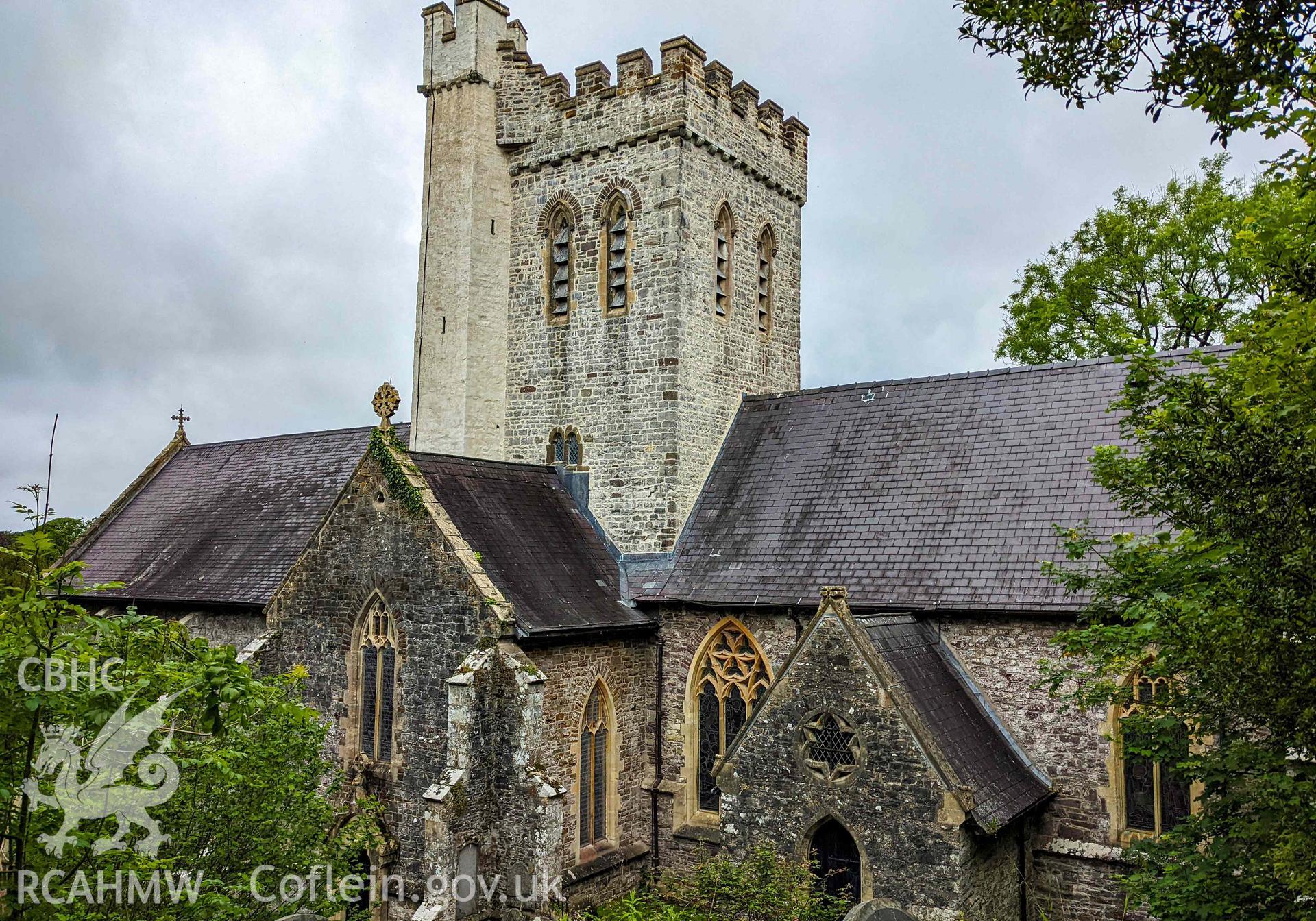Elevated photo of south elevation transept gable entrance and tower. Looking north west