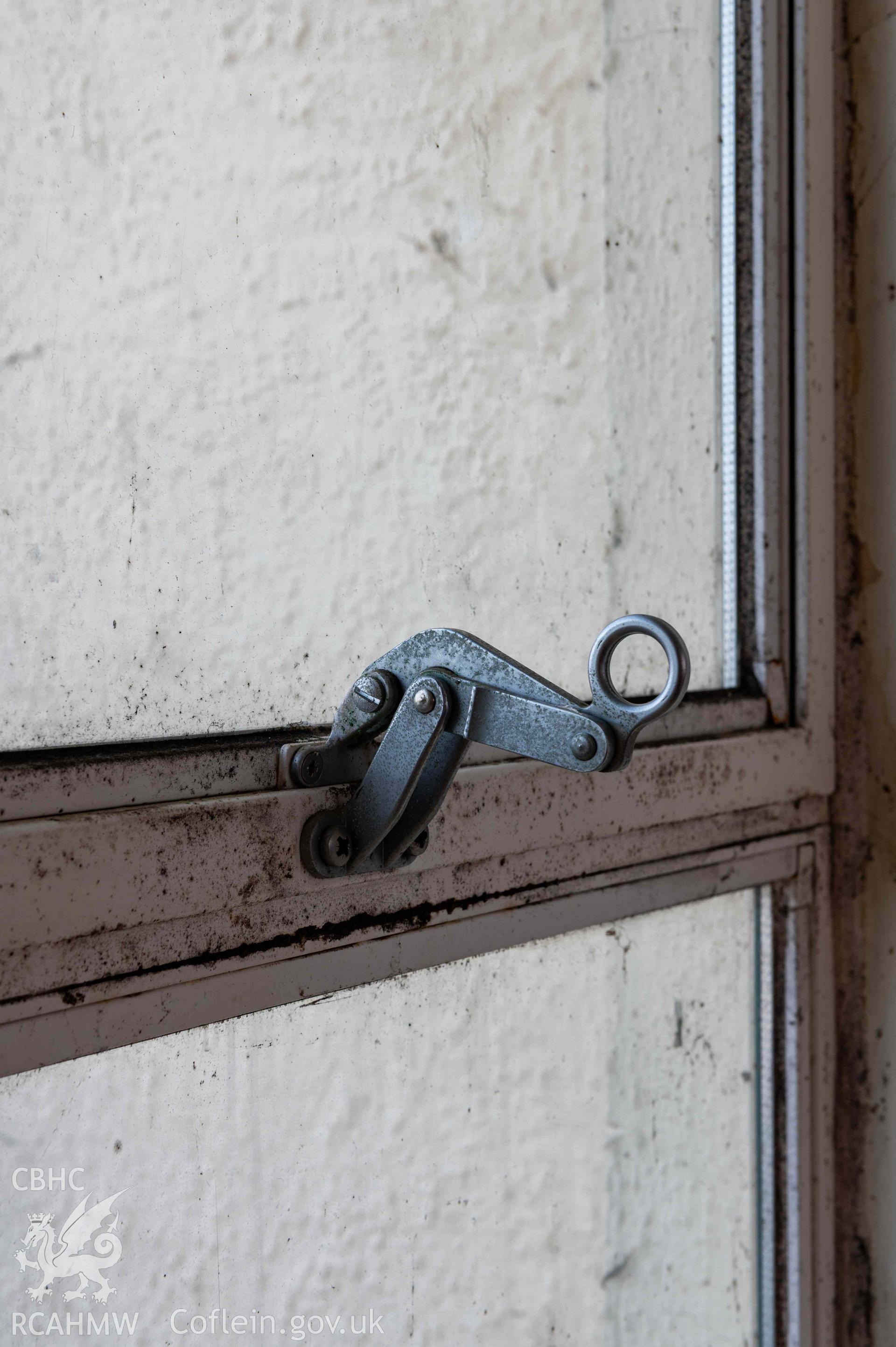 Detail of classroom window latch. North central range first floor