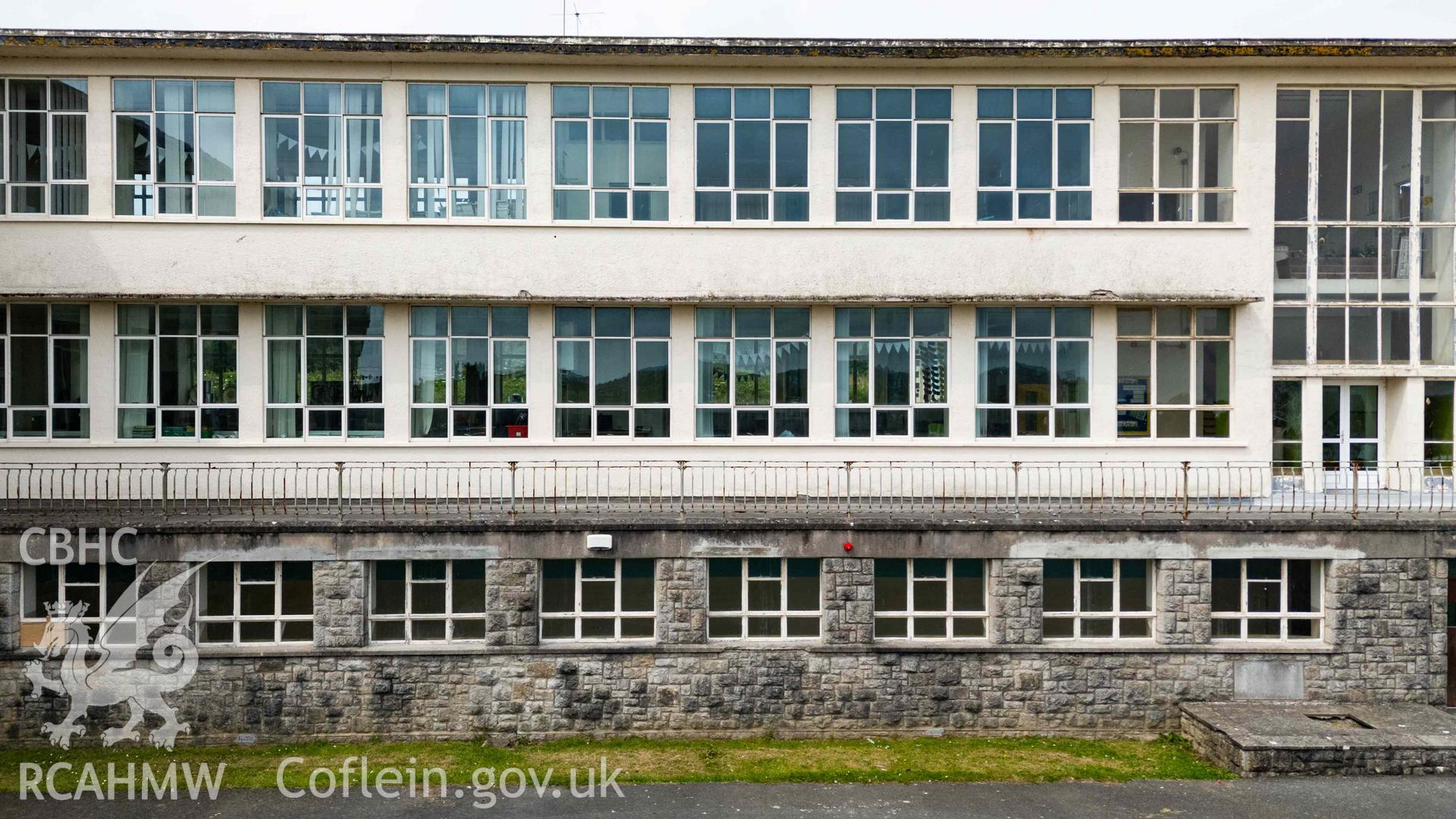 Low aerial photo of south range east elevation. Windows and balcony