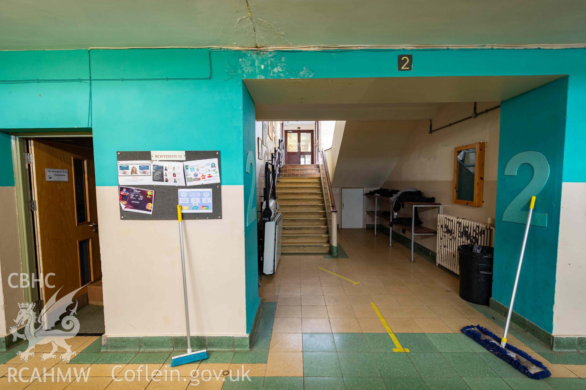 View from corridor to staircase to first floor. North central range corridor