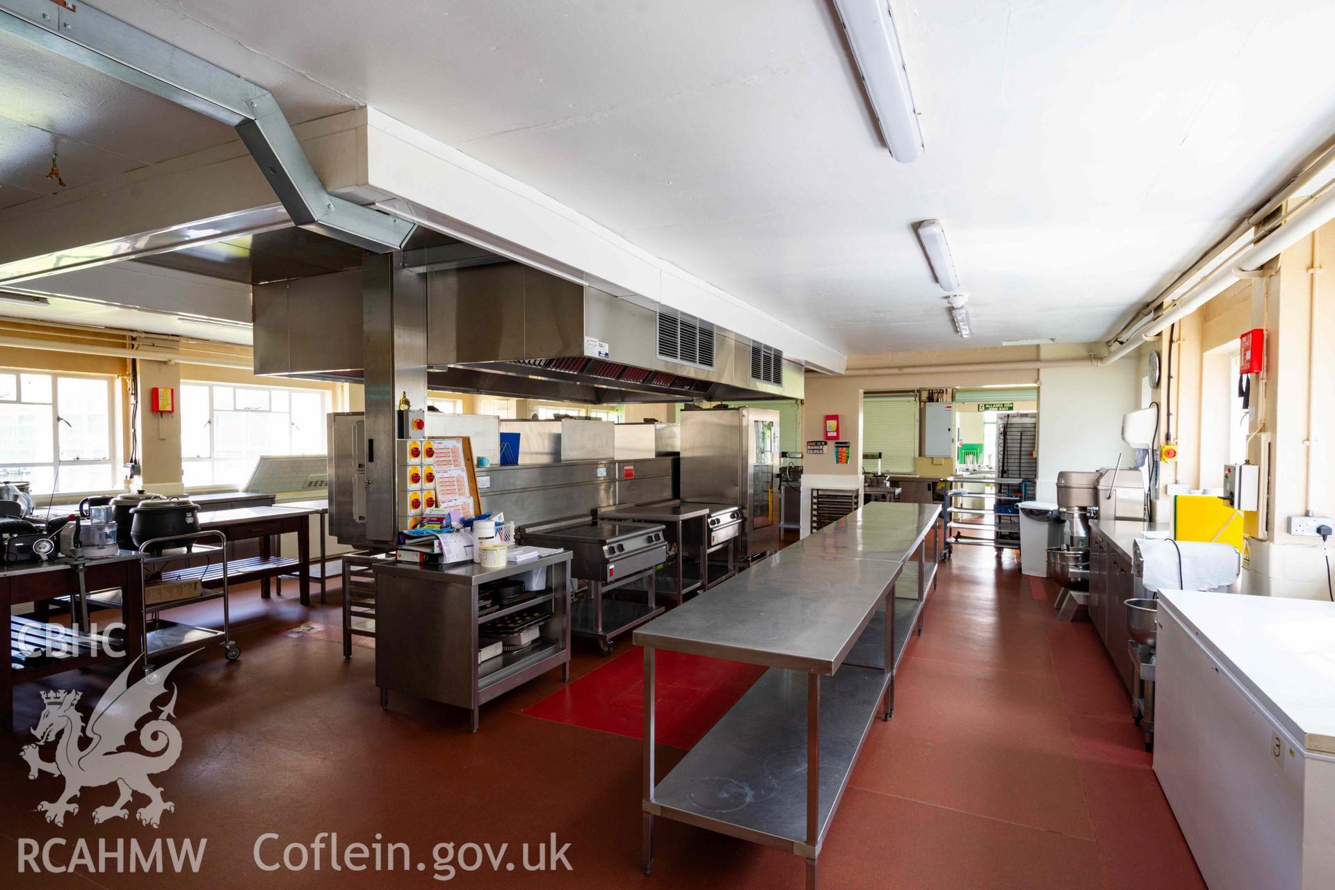 View from rear of kitchen towards serving hatches, out to canteen