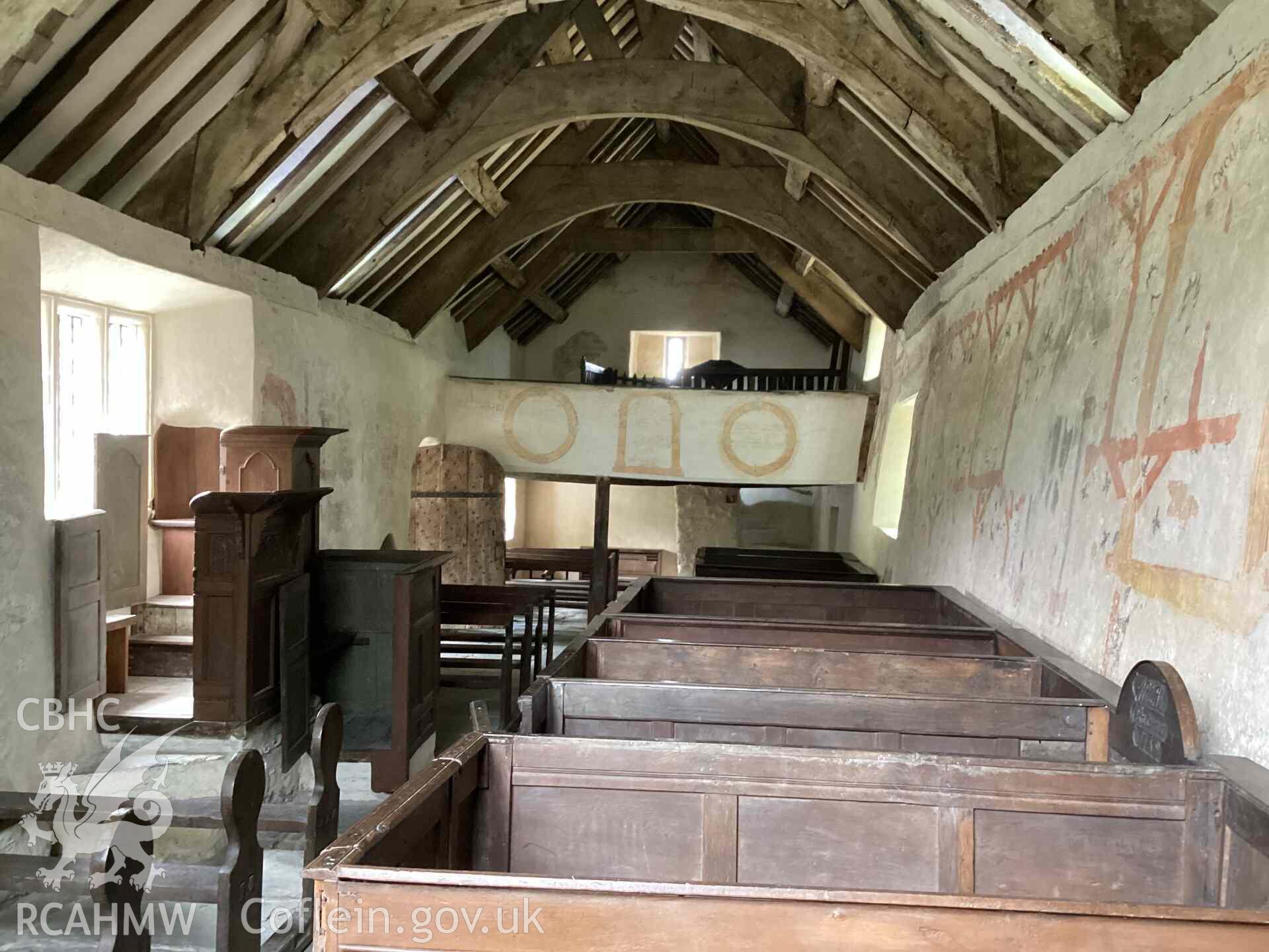 Digital photograph showing interior of Llangar Church looking towards the west gallery. Photographed by Nicola Roberts of RCAHMW, 27 July 2025.