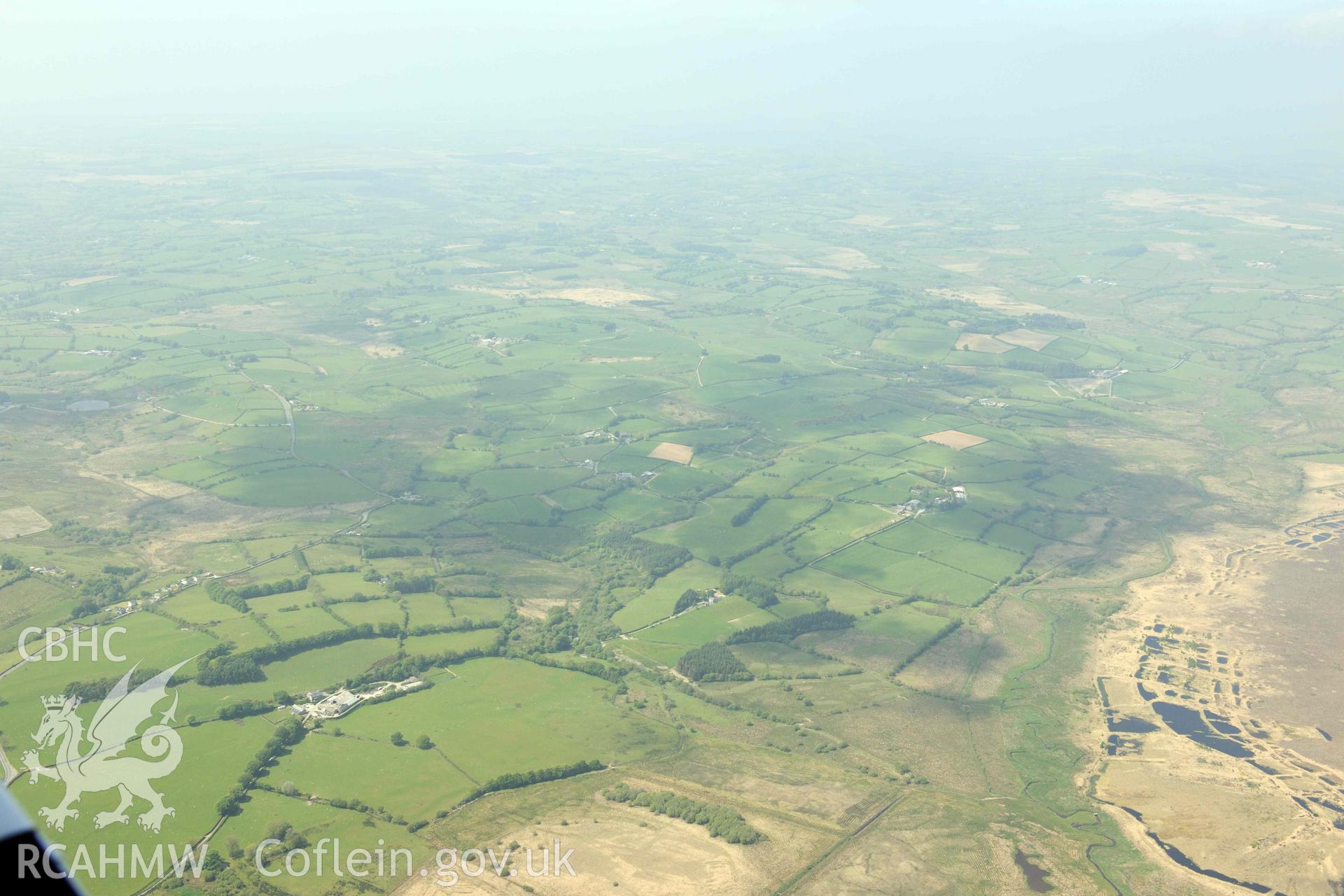 RCAHMW Colour Oblique Digital Aerial Photographs: Fullbrook, dwelling and site of burnt mounds, in wide landscape from south-east