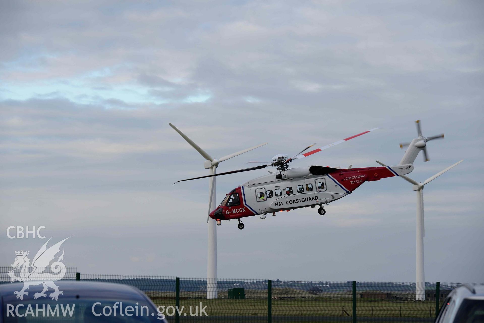 Caernarfon Airfield - View of a helicopter taking off from the airfield, taken from West