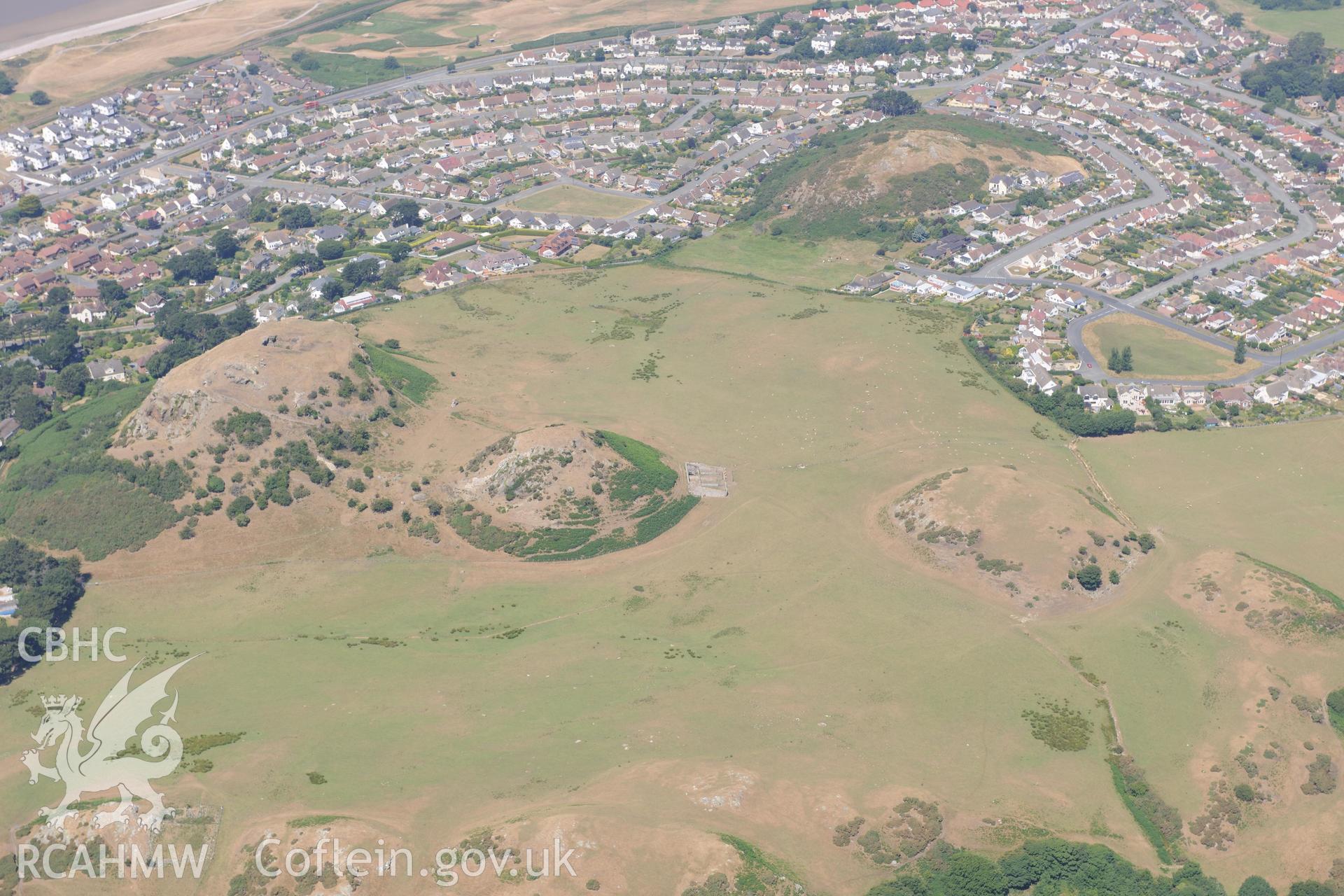 Oblique aerial photograph taken during the Royal Commission’s programme of archaeological aerial reconnaissance: Deganwy Castle - View with drought parching