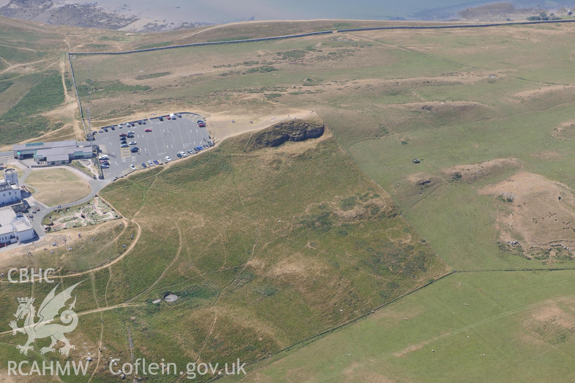 Oblique aerial photograph taken during the Royal Commission’s programme of archaeological aerial reconnaissance: Great Orme summit complex - Record of parchmarks across summit of Great Orme