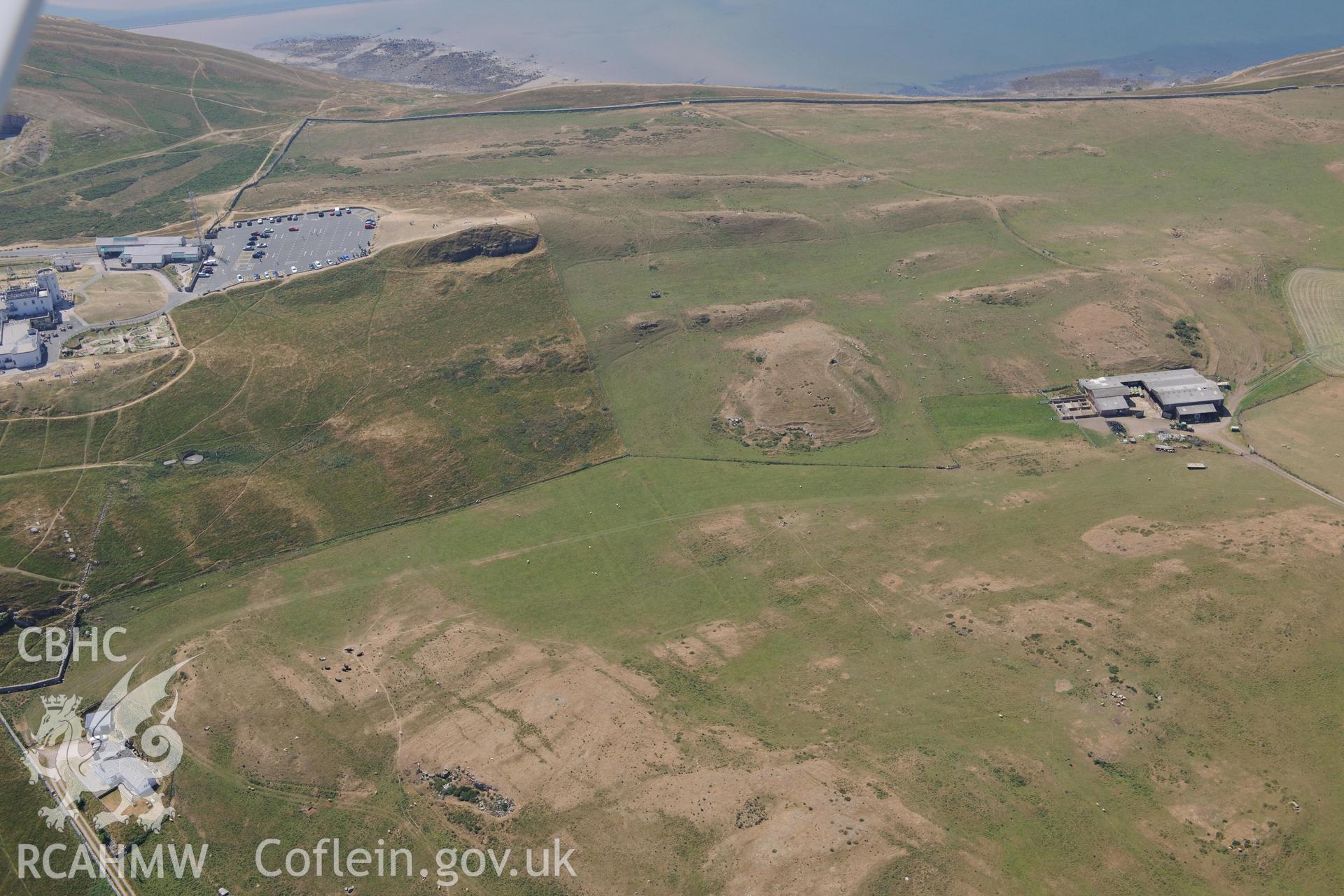 Oblique aerial photograph taken during the Royal Commission’s programme of archaeological aerial reconnaissance: Great Orme summit complex - Record of parchmarks across summit of Great Orme