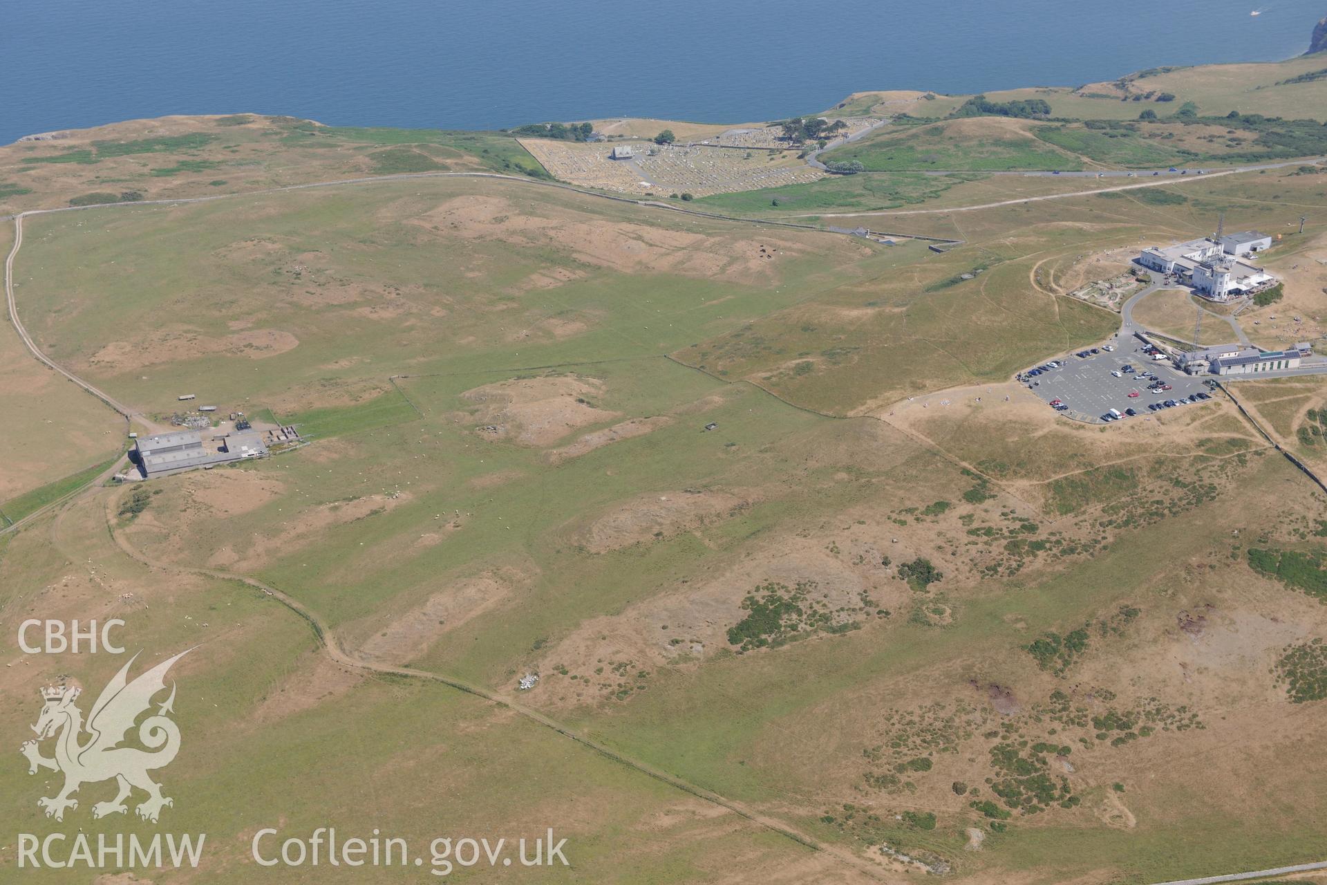 Oblique aerial photograph taken during the Royal Commission’s programme of archaeological aerial reconnaissance: Great Orme summit complex - Record of parchmarks across summit of Great Orme