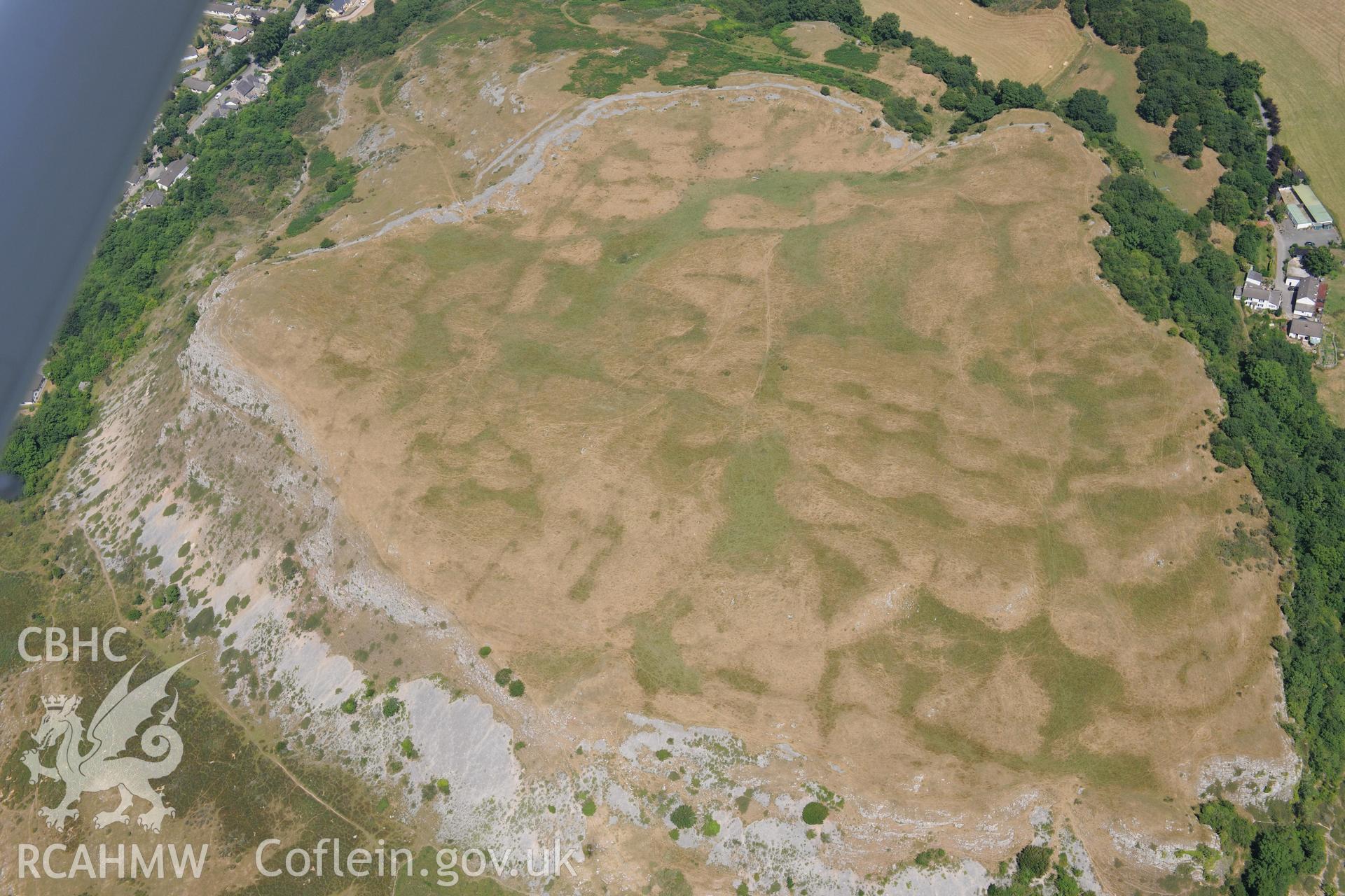 Oblique aerial photograph taken during the Royal Commission’s programme of archaeological aerial reconnaissance: Pen-y-Corddyn-Mawr hillfort - View with drought parching