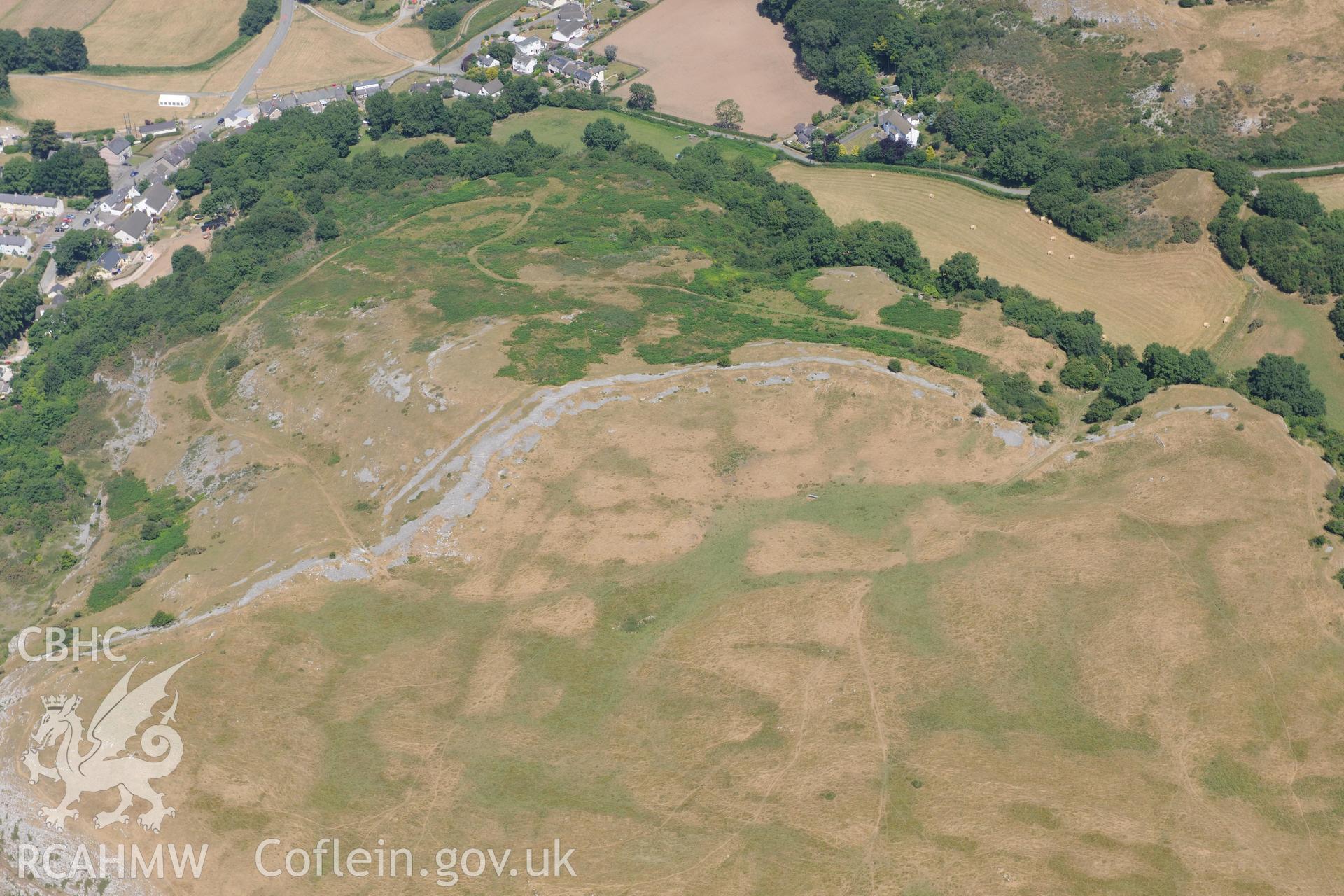 Oblique aerial photograph taken during the Royal Commission’s programme of archaeological aerial reconnaissance: Pen-y-Corddyn-Mawr hillfort - View with drought parching