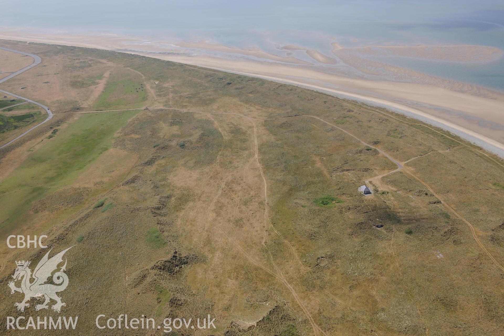 Oblique aerial photograph taken during the Royal Commission’s programme of archaeological aerial reconnaissance: Llandwrog Airfield, minefield - View of minefield in coastal dunes from north