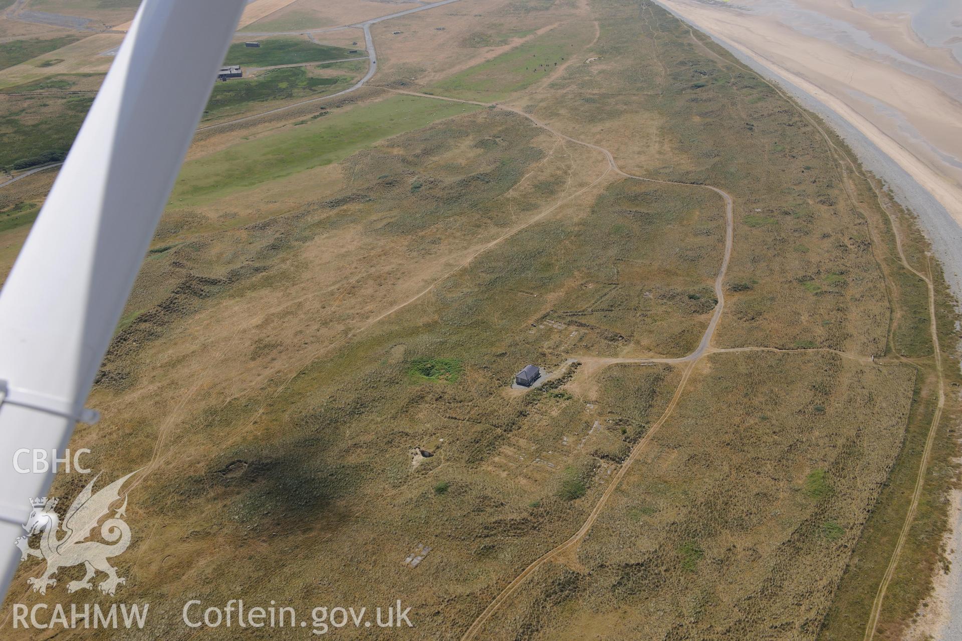 Oblique aerial photograph taken during the Royal Commission’s programme of archaeological aerial reconnaissance: Llandwrog Airfield, minefield - View of minefield in coastal dunes from north