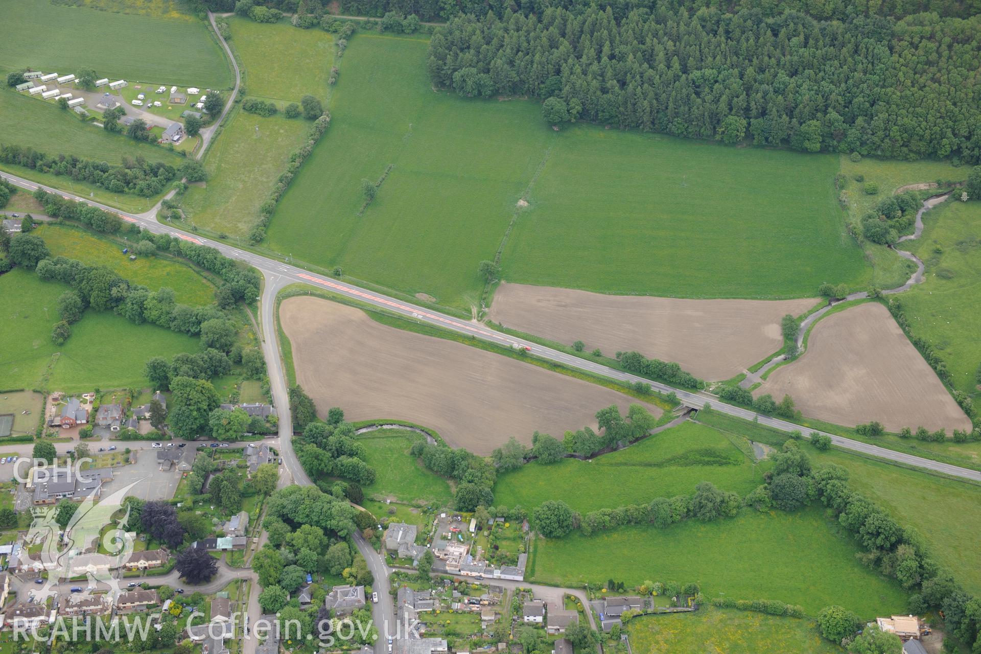 Oblique aerial photograph taken during the Royal Commission’s programme of archaeological aerial reconnaissance: New Radnor, town defences-View of southern defences with ploughing