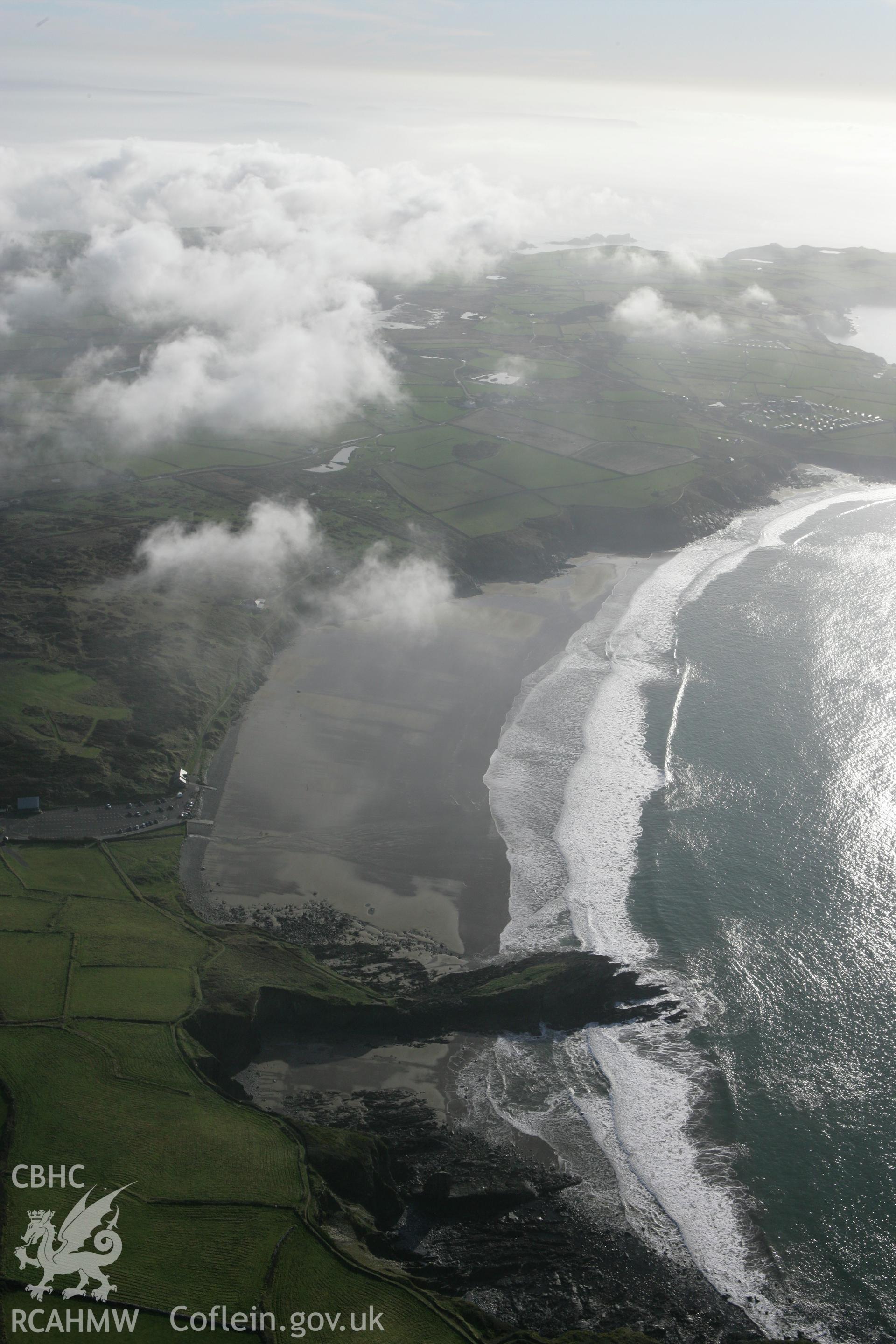 RCAHMW colour oblique aerial photograph of Whitesands Bay. A landscape view towards Ramsey Island, with clouds. Taken on 28 January 2009 by Toby Driver