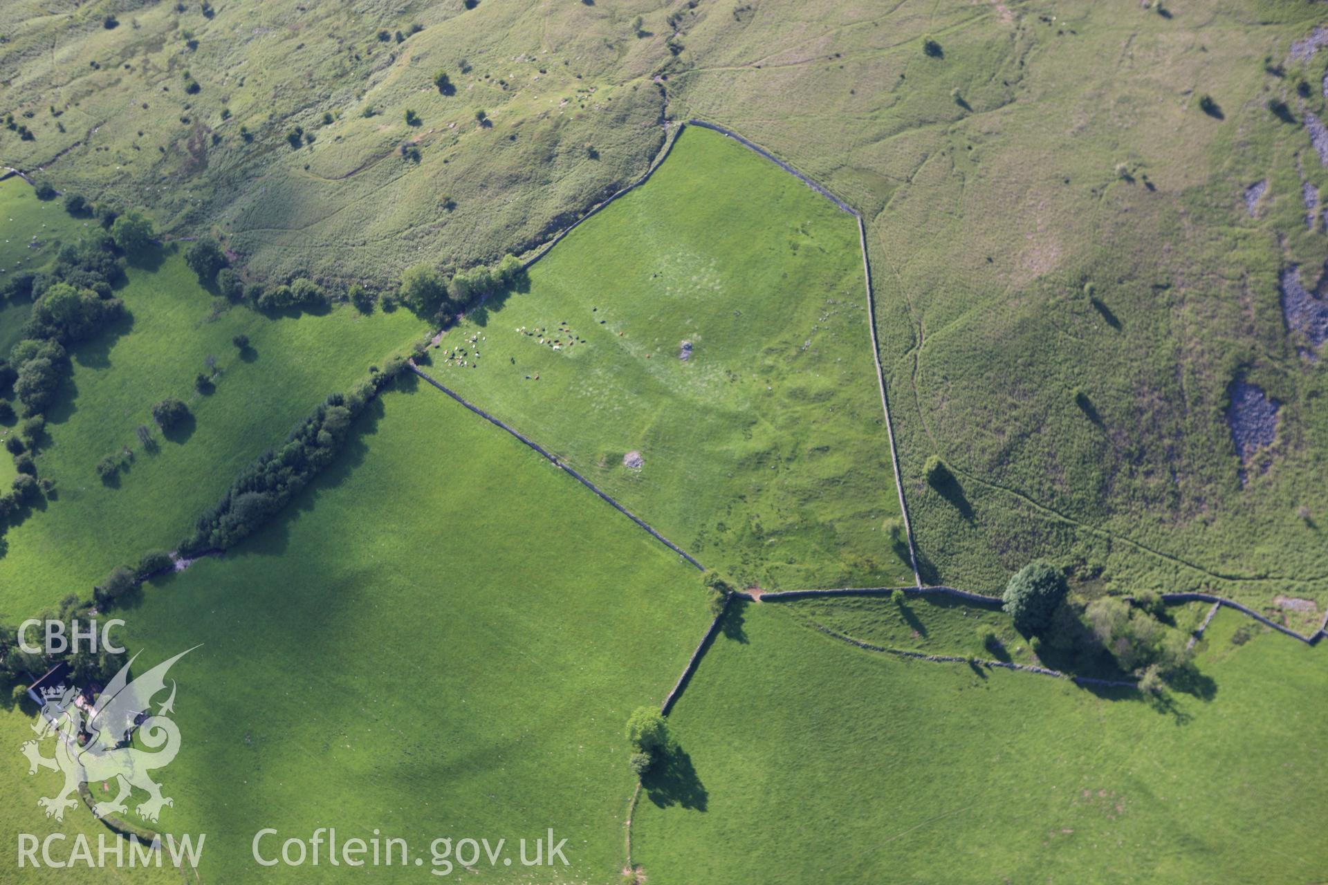 RCAHMW colour oblique aerial photograph of Upper Barn Deserted Settlement. Taken on 11 June 2009 by Toby Driver