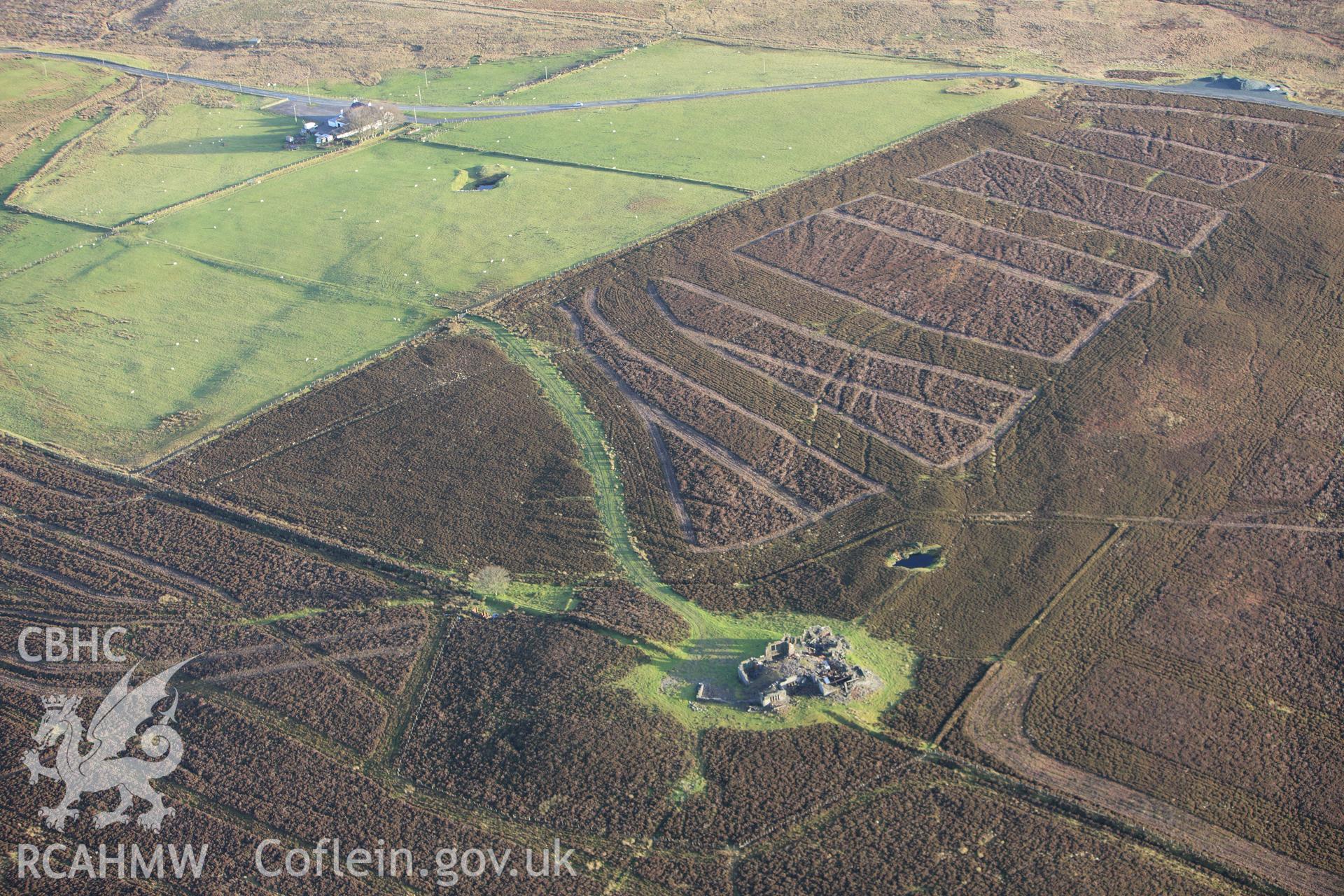 RCAHMW colour oblique aerial photograph of Gwylfa Hiraethog Shooting Lodge, in ruins. Taken on 10 December 2009 by Toby Driver