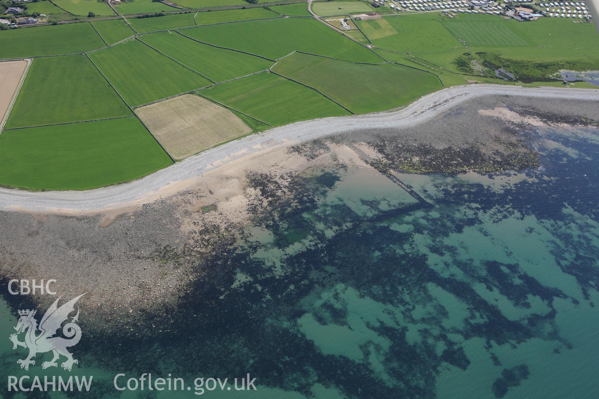 RCAHMW colour oblique aerial photograph of Llwyngwril Fish Trap I. Taken on 02 June 2009 by Toby Driver