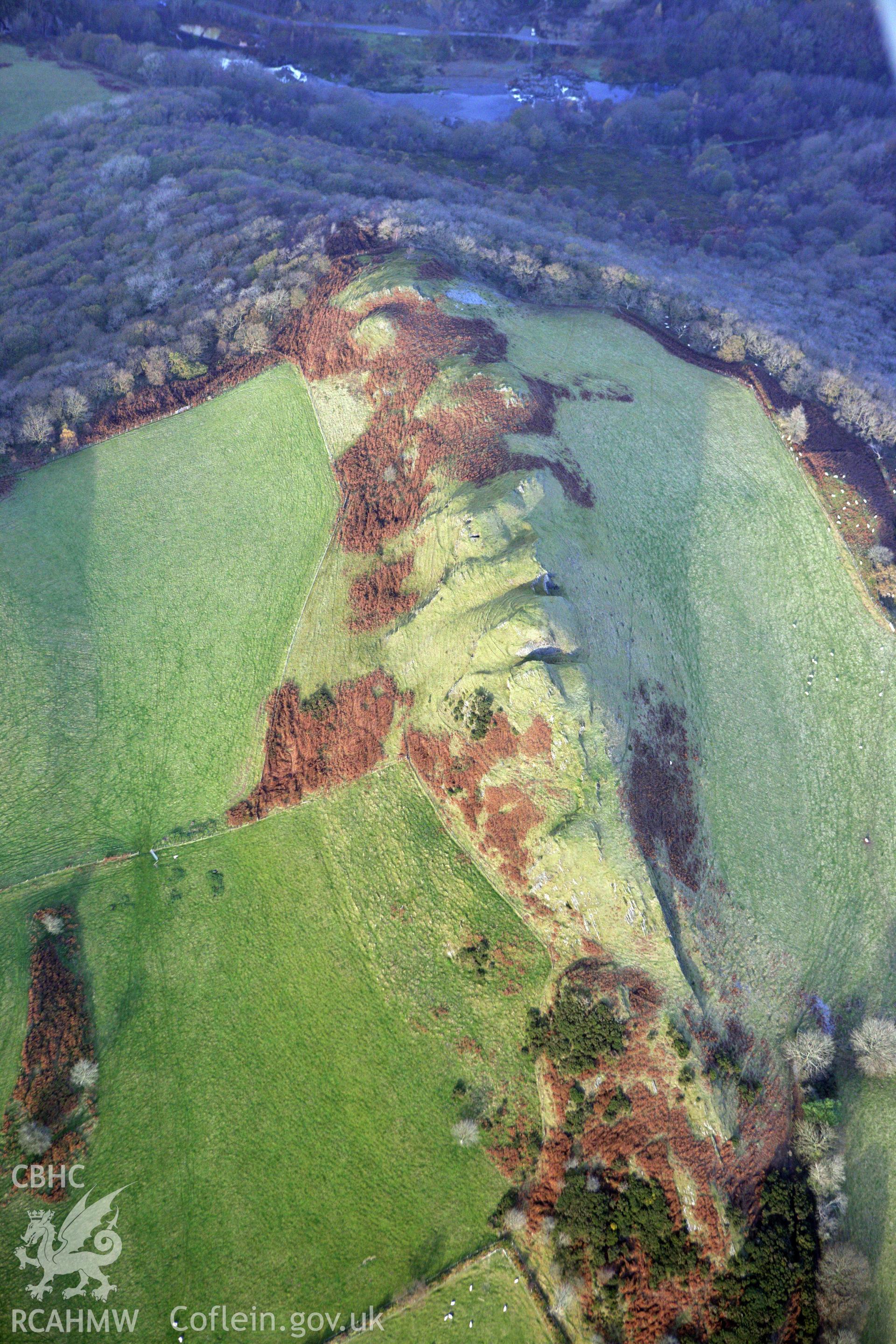 RCAHMW colour oblique aerial photograph of an outcrop at Castell. Taken on 09 November 2009 by Toby Driver