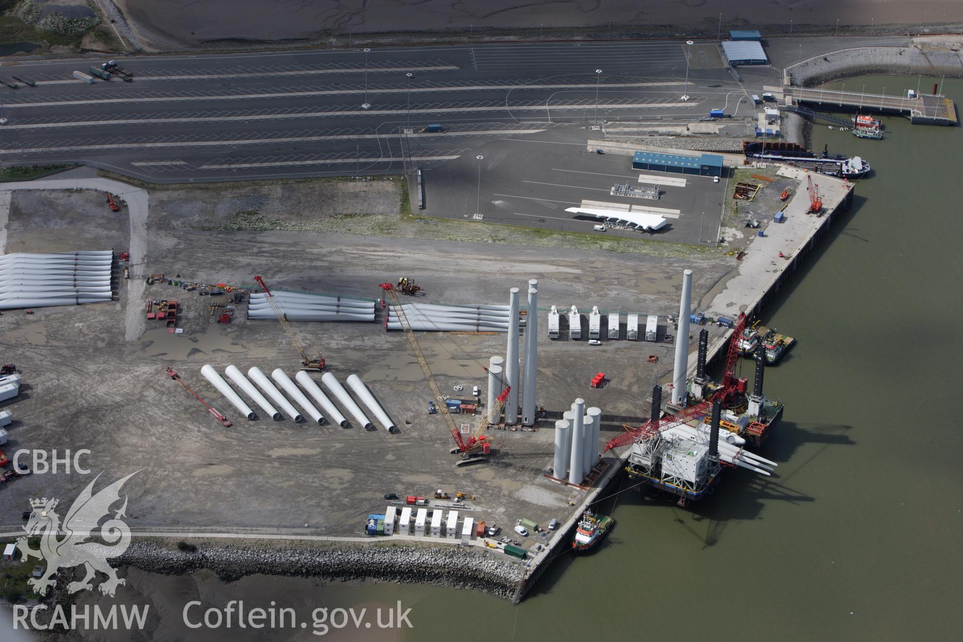 RCAHMW colour oblique aerial photograph of Mostyn Quay, with wind turbines. Taken on 30 July 2009 by Toby Driver