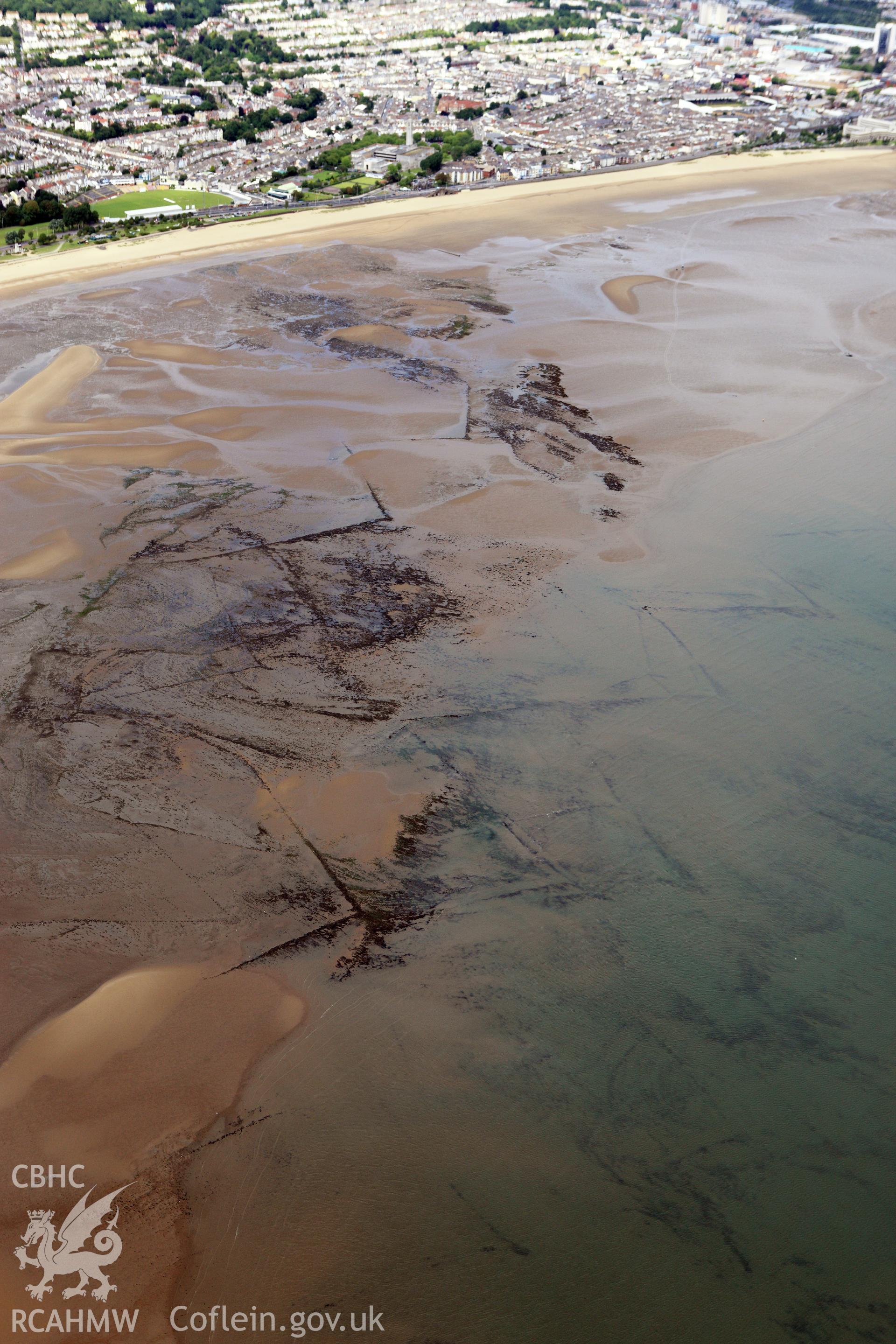 RCAHMW colour oblique aerial photograph of Swansea Bay Fish Traps. Taken on 09 July 2009 by Toby Driver