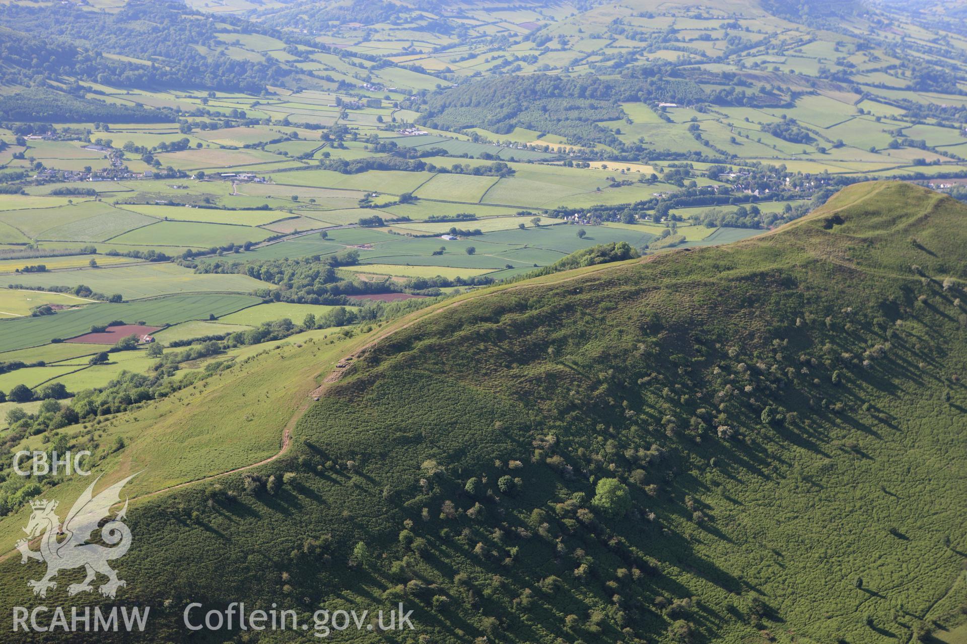 RCAHMW colour oblique aerial photograph of Skirrid Fawr Summit Enclosure. Taken on 11 June 2009 by Toby Driver